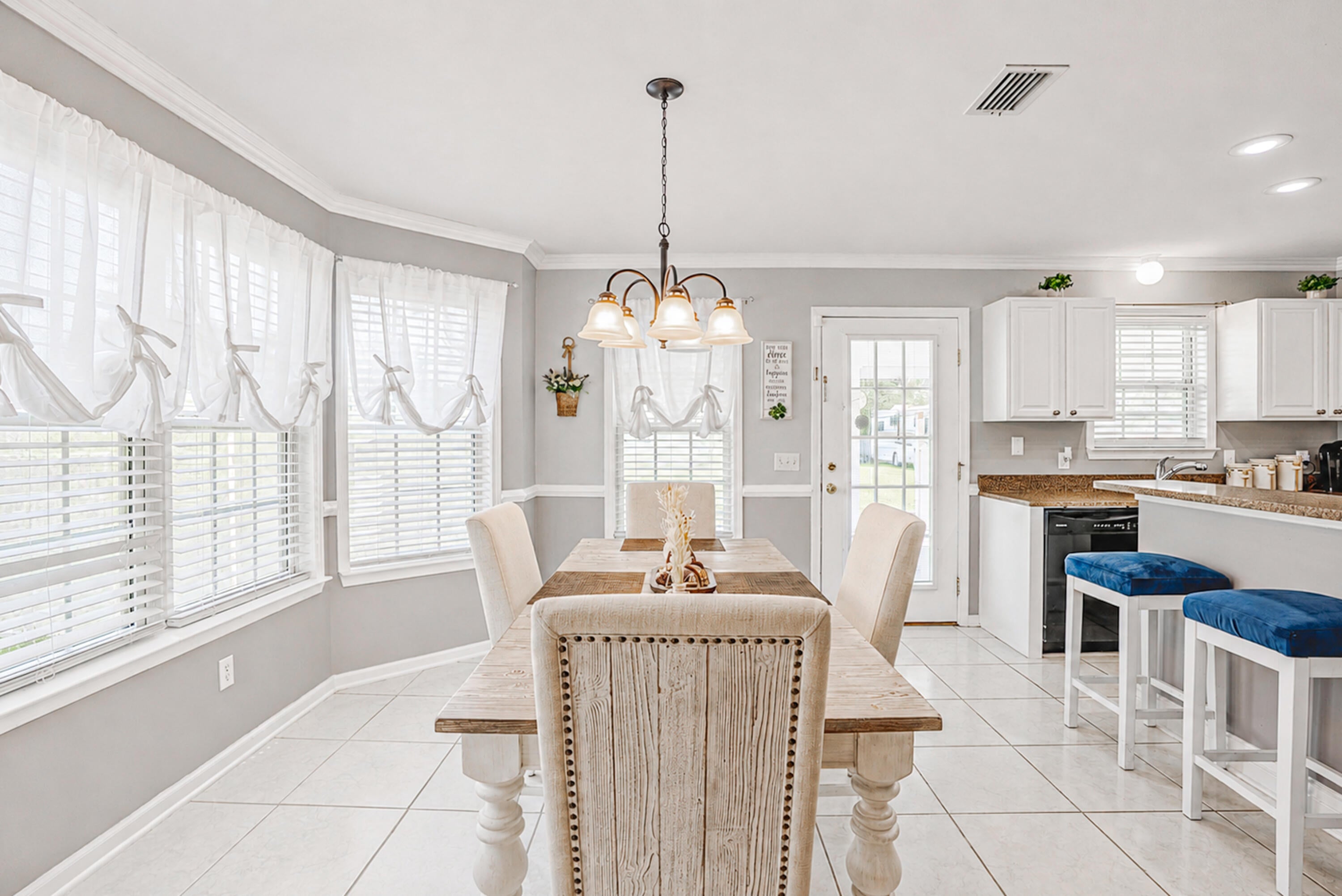 NO HOA! RARE 0.5-ACRE COMPOUND WITH POWERED 24x34 DETACHED WORKSHOP! Escape the cookie-cutter subdivisions. This unique Panama City gem features a massive, custom-built 24x34 wood-framed detached shop equipped with a standard roll-up garage door, side entry door, and dedicated electrical power--the ultimate setup for boats, project cars, or a heavy-duty trade workspace. Nestled on a beautifully maintained, fully fenced .48-acre lot, you have total freedom to park your RV or trailers with zero restrictive rules.Step inside this classic Craftsman-style residence to find durable, scratch-resistant Luxury Vinyl Plank (LVP) flooring stretching across the main living level, transitioning into a low-maintenance, fully tiled kitchen built for high-traffic utility. Designed for maximum structural privacy, this 3-bedroom, 2.5-bathroom footprint offers distinct living zones and warm character. The upstairs interior has been freshly painted, creating a bright, turn-key atmosphere.Enjoy massive, long-term peace of mind with heavy-hitting mechanical upgrades: energy-saving solar panels to slash your electric bills, a new roof (Dec 2018), a new HVAC system (2021), a brand-new layer of 13 inches of blown-in R-38 attic insulation, and a septic tank pumped just one year ago. Located in 32404 with an easy commute to Tyndall AFB, local boat launches, and daily essentials. This isn't just a house--it's an unrestricted hobbyist paradise built for real utility!