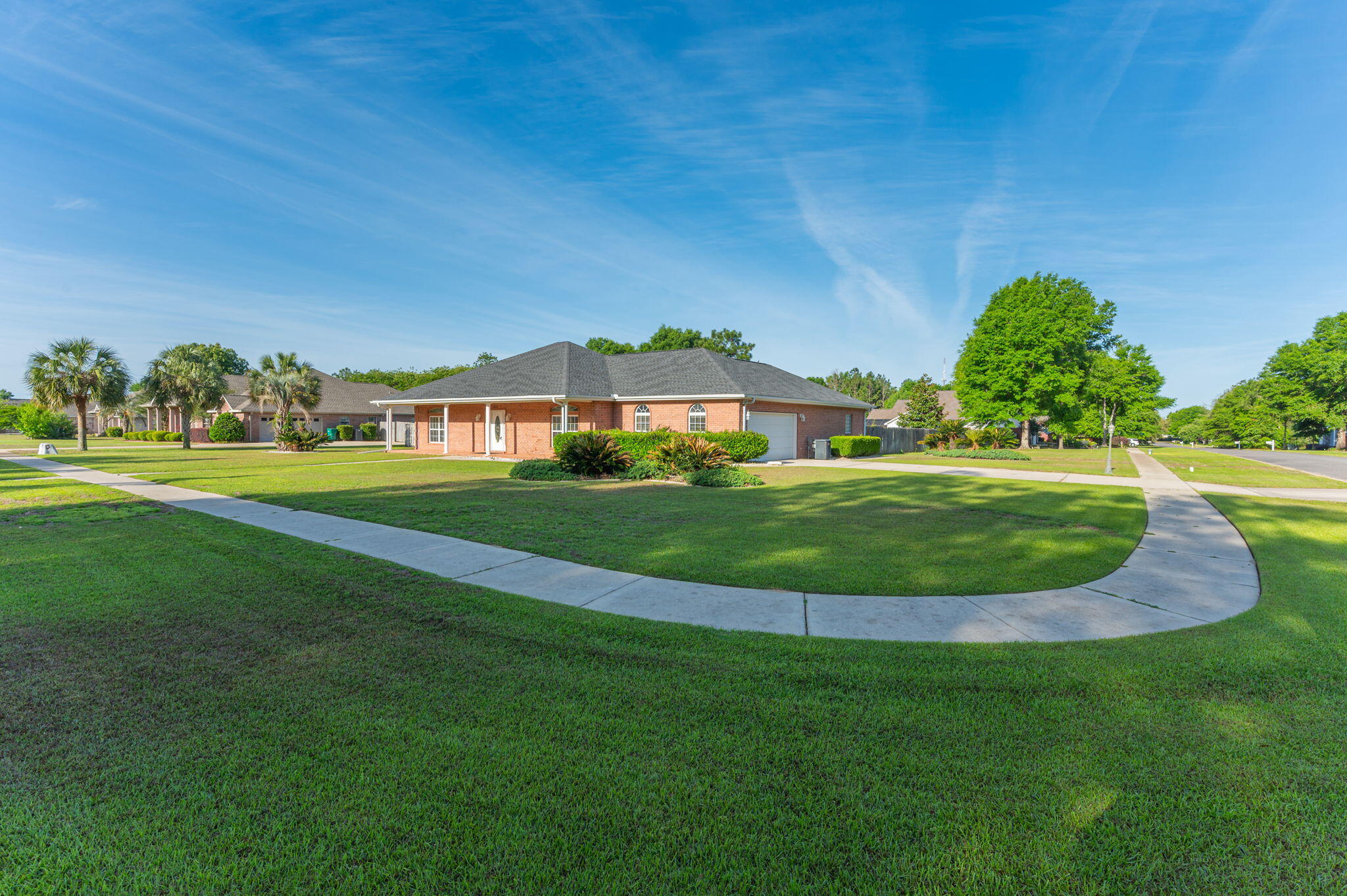 Located in a gated community in the heart of Crestview, this beautifully maintained private pool home sits on a spacious corner lot and has been freshly painted, offering both style and peace of mind from the moment you arrive. Positioned in a central part of town, the home provides an easy commute to local bases, white-sand beaches, and a variety of shopping and dining options.
Inside, you'll find a well-designed layout featuring 3 bedrooms and 2.5 bathrooms with a split floor plan that offers both functionality and privacy. The main living area showcases vaulted ceilings, hardwood flooring, and an open, inviting feel that flows seamlessly into the dining spaces and kitchen. The kitchen is well-equipped with solid wood cabinetry, Corian countertops, stainless steel appliances--including a newer oven and microwave,a pantry, and a convenient breakfast bar for everyday living.
The primary suite is generously sized and tucked away for added privacy, featuring a tray ceiling and a spacious en-suite bathroom with double vanities, a soaking tub, separate shower, and a large walk-in closet. Two additional oversized bedrooms are located on the opposite side of the home, sharing a full bathroom and offering ample closet space.
Step outside and enjoy true Florida living with multiple outdoor areas designed for relaxation and entertaining. A covered and screened porch overlooks the beautifully maintained in-ground pool, surrounded by mature landscaping and a large fenced backyard. The side-entry two-car garage adds both convenience and curb appeal, while additional features such as attic storage with decking enhance overall functionality.
Recent updates include a roof (2020), HVAC system (2021), tankless water heater, a PEX plumbing system, making this home move-in ready. Located in a highly desirable community, this property offers the perfect combination of comfort, location, and lifestyle.