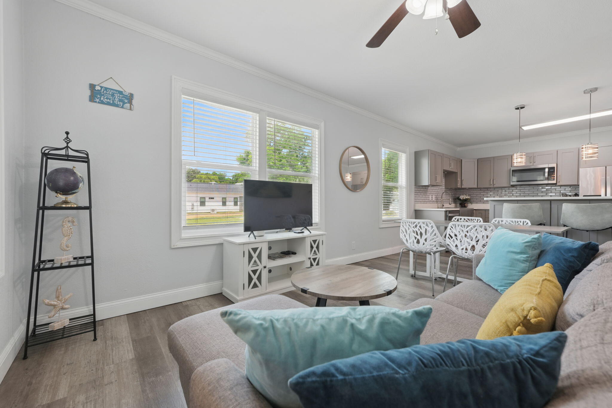 Motivated Seller!! BRING ALL OFFERS!! Ask about Seller paying closing costs! Rental projections coming in at over $35,000 yearly! Welcome to this charming and FULLY FURNISHED 3-bedroom, 2-bathroom home located in the heart of Pensacola. Just minutes from downtown and 15 minutes from the stunning white sands of Pensacola Beach, this centrally located gem offers the perfect blend of stylish upgrades and convenience. Completely renovated from top to bottom in 2021, every detail of this home has been thoughtfully designed with modern living in mind. Step inside to an open-concept floor plan filled with natural light, neutral paint, and luxury vinyl plank flooring throughout. The spacious living area flows seamlessly into a stunning kitchen that's truly the heart of the home! Enjoy cooking wit