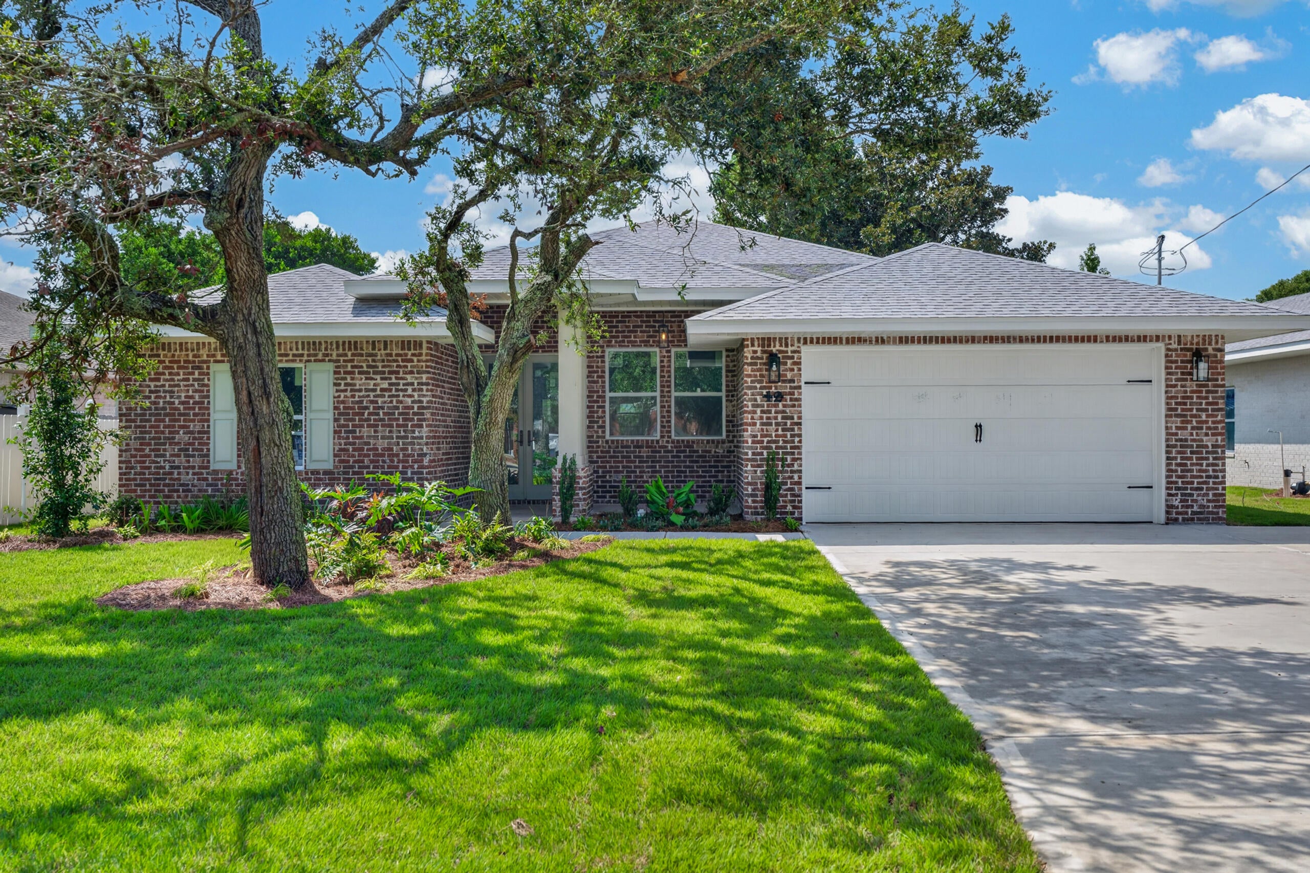This beautiful 4-bedroom, 3-bath brick home combines timeless design with modern touches. An 8-foot entry door sets the tone for the quality and charm found throughout. The kitchen is equipped with an oversized fridge and freezer, complemented by a wet bar and separate drink fridge perfect for entertaining.

Guest bathrooms feature oversized 42-inch tubs, while the primary suite offers a floor-to-ceiling tiled shower, a 6-foot soaking tub, private water closet, and separate his and her closets.

Outside, enjoy a large, gorgeous oak tree filled yard with a spacious back porch. A two-car garage provides secure parking and storage. This home is a perfect mix of comfort, luxury, and functionality. Completion expected at the end of mid Sept. 2026.