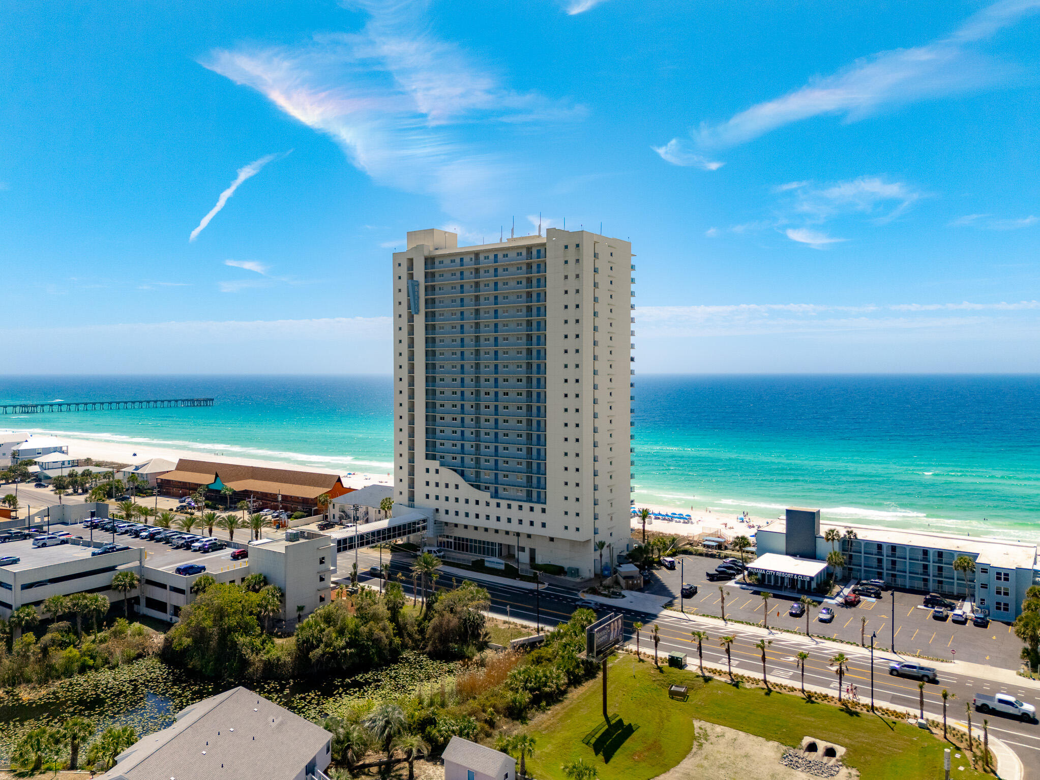 Welcome to an exceptional 23rd-floor residence offering an elevated standard of coastal luxury and sweeping, unobstructed views that truly captivate. This impeccably maintained 3-bedroom, 3-bathroom condo showcases a rare and highly desirable lockout floor plan. Designed with a private kitchenette and separate balcony, ideal for hosting guests in style, maximizing rental potential, or enjoying added privacy and flexibility.

From the moment you enter, you're greeted by an open, airy layout, refined finishes, and expansive windows that frame the stunning scenery from nearly every angle. Beyond the residence, indulge in resort-style amenities including a massive pool and relaxing hot tub, creating the perfect setting to unwind or entertain while soaking in the coastal ambiance. Whether you're seeking a beautiful primary residence, an upscale vacation retreat, or a high-performing investment property, this extraordinary condo delivers on every level. This stunning residence is being offered fully furnished for a seamless, turnkey experience. Come see these breathtaking views for yourself!