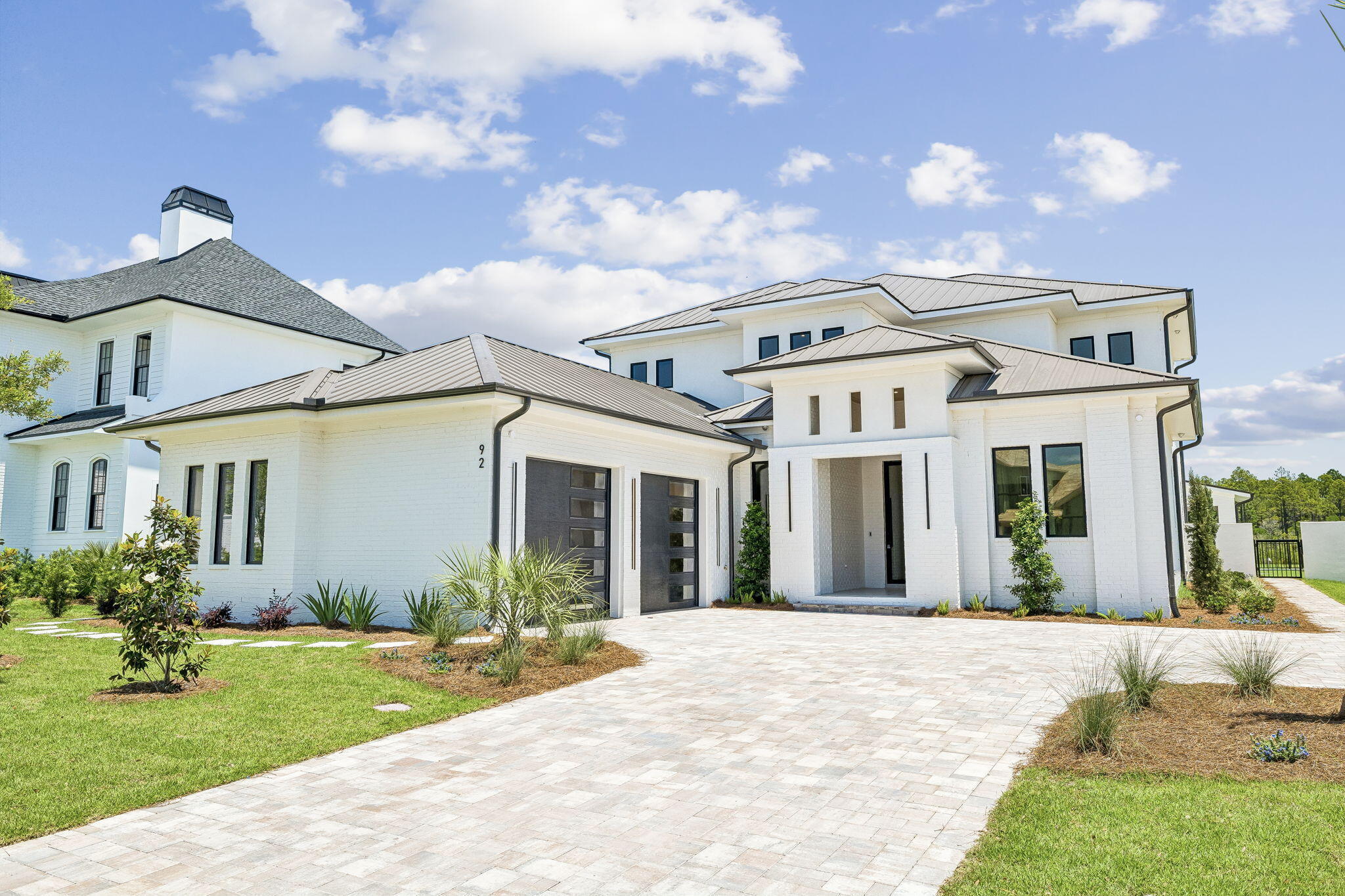 Behind the gates of Watersound Camp Creek, this newly constructed modern masterpiece was designed for buyers who refuse to compromise. Warm white oak finishes and clean architectural lines create a home that feels both sophisticated and effortlessly livable. Expansive Eurowall accordion sliders open completely to a private outdoor retreat featuring a resort-style pool, putting green, outdoor kitchen, and peaceful pond frontage.
Built with exceptional craftsmanship, the home features Sierra Pacific clad impact windows with thermal insulation, pivot entry doors, white oak interior doors with hidden hinges, wide-plank white oak hardwood floors, and sleek custom cabinetry finished with premium hardware throughout.
A detached pool house offers endless possibilities--ready to become a private guest suite, studio, wellness space, or executive office. Three balconies overlook Point Washington, while the standing seam metal roof and striking modern design set this home apart from anything else on 30A.
Included is the coveted Watersound Club membership with access to a private beach club, three championship golf courses, and exclusive restaurants and amenities. This is not a cookie-cutter spec home--it is a true luxury coastal estate built for the buyer who wants one of the finest modern homes on the Emerald Coast.