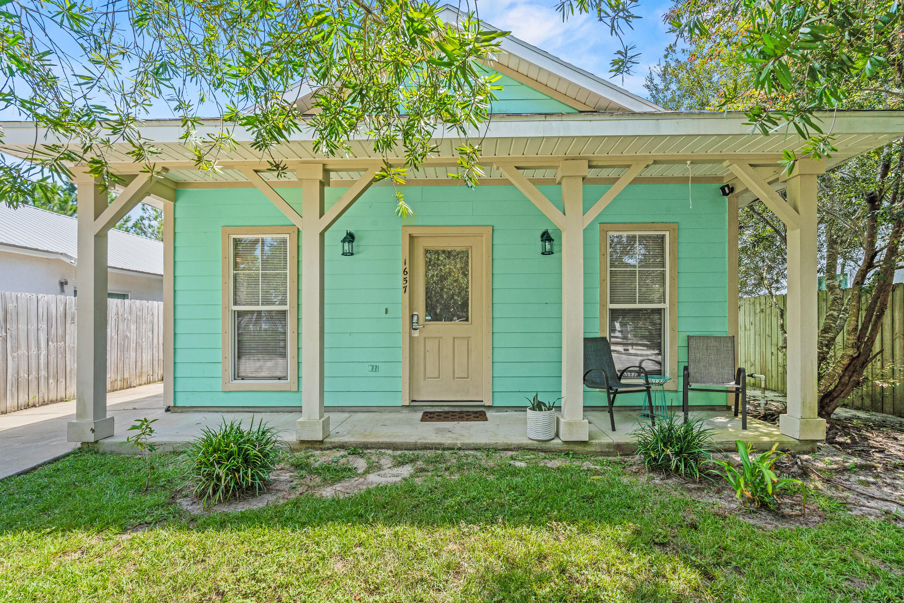 Welcome to this charming Florida cottage tucked away in a tranquil community in North Santa Rosa Beach. While it currently serves as a vacation rental for the current owner, it would also make a wonderful home or home-away-from-home. All furnishings are subject to negotiations with the exception of the artwork which does not belong to the current owner. 

This 3-bedroom, 2-bath home offers 1,174 square feet of comfortable single-level living, complete with a welcoming covered front porch and classic coastal cottage character.

Inside, the functional floor plan features 9-foot ceilings, a spacious living area, dining space, and a kitchen with granite countertops and tile flooring. The primary bedroom and two additional bedrooms provide plenty of flexibility for everyday living, guests, or a home office.

Situated on a level lot along a paved road, the property offers a low-maintenance setting surrounded by the natural beauty of Santa Rosa Beach.

Enjoy the laid-back lifestyle of North Santa Rosa Beach while remaining conveniently connected to the beaches, dining, shopping, and entertainment that make South Walton such a sought-after place to call home. Whether you're looking for a primary residence, second home, or an opportunity to make a space your own, 1657 Indian Woman Road is ready for its next chapter.