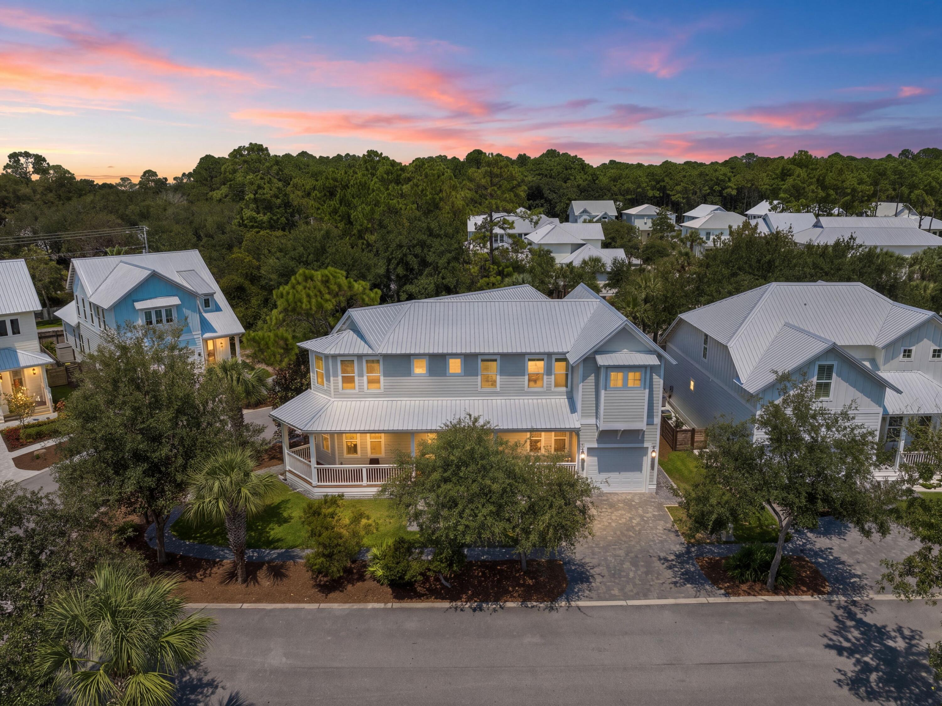 Thoughtfully designed for everyday comfort with generous indoor and outdoor spaces, this newer-build four-bedroom, four-bath home offers approximately 2,700 square feet on a desirable corner lot in the gated Hidden Grove community. From its wraparound front porch to its spacious interiors and large rear porch, the home brings together the features that make full-time coastal living both comfortable and convenient.

Inside, 10-foot ceilings on the first floor and nine-foot ceilings upstairs create an open, airy feel throughout the two-story floor plan. Vinyl plank flooring extends throughout the home, providing a cohesive finish well suited for an active lifestyle. Two spacious living areas offer flexibility for gathering, entertaining or creating separate spaces for adults and children. 

The kitchen is complemented by high-end appliances that convey with the home, while the included washer and dryer add move-in convenience. Two HVAC systems provide efficient year-round comfort across both levels. Four bedrooms and four baths provide ample accommodations for family and guests, while the one-car garage adds valuable storage and covered parking. Large closets with built-ins streamline storage. Outdoor spaces are equally inviting, beginning with a wraparound front porch that enhances the home's classic Southern character. A large rear porch creates another comfortable place to relax, dine outdoors or keep an eye on children riding bikes through the neighborhood.

Hidden Grove offers the privacy of a gated setting along with a community pool located just steps from the home. The neighborhood is conveniently located near Choctawhatchee Bay, Sacred Heart Hospital, Walmart, and the shopping, dining, and entertainment options at Grand Boulevard. The emerald waters and sugar-white sand of the Gulf of Mexico are also just a short drive away.

With newer construction, a corner-lot setting, two living areas, generous porches and convenient access to everyday necessities and the coast, this home offers a spacious and well-appointed option for full-time living or a second home.