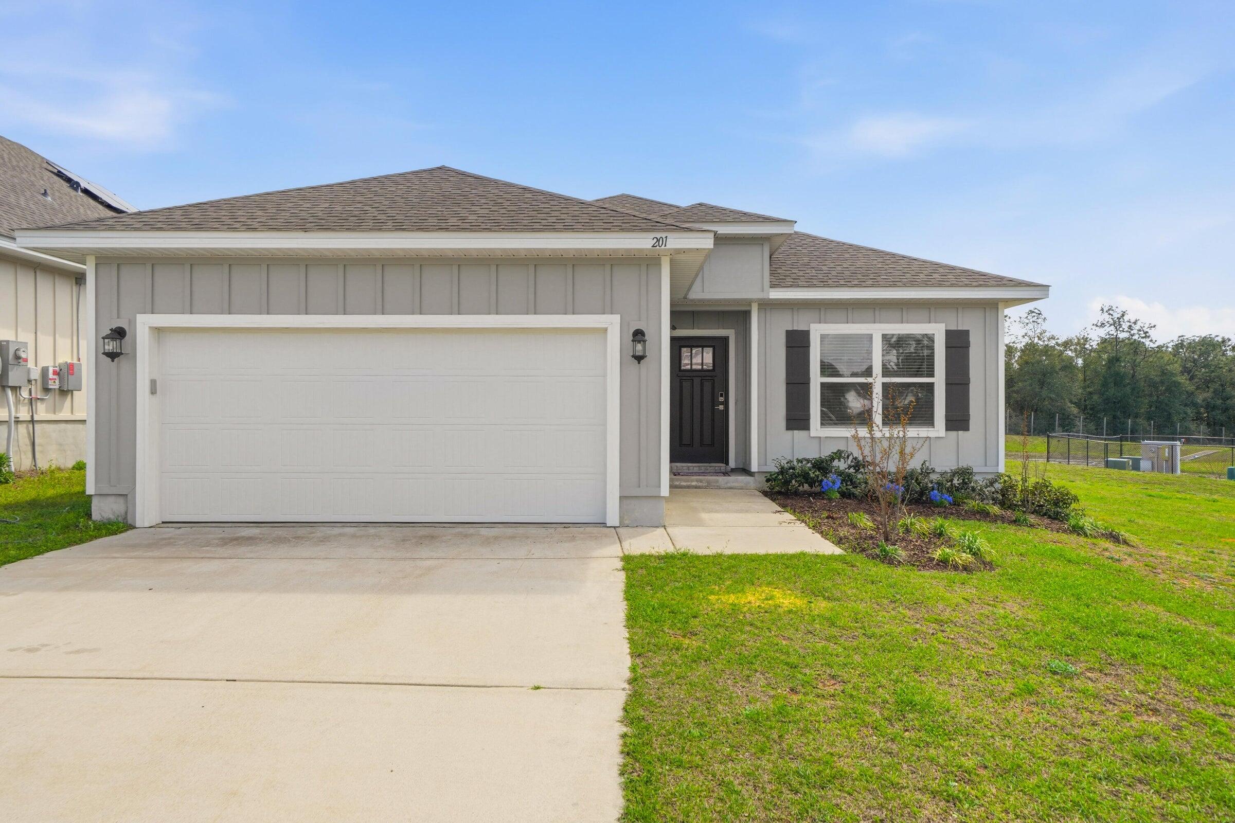 Available now and immaculate.....Beautiful finishes in this 3/2 in South Crestview home in Magnolia Creek.  Easy access to bases, beaches and shipping.  Custom paint accents throughout the home.  The flex space can be an office space, work out room, formal dining area or craft area.  Open concept floorplan lives large with an abundance of space for the whole family.  The kitchen boasts white cabinets, quartz counters, breakfast bar and large pantry.  Laminate flooring in the main living areas makes the home both attractive and easy to maintain. The primary suite includes a large walk-in closet, en suite bath with a double vanity, a soaking tub, and a separate shower. EV Car Charger.  2 car garage, privacy fenced back yard and spacious covered back porch for outdoor entertaining and watching the sunsets.  Small dog allowed with owner approval.  No inside smoking and no vaping in the home or garage.  Corner lots adds great curb appeal and privacy.