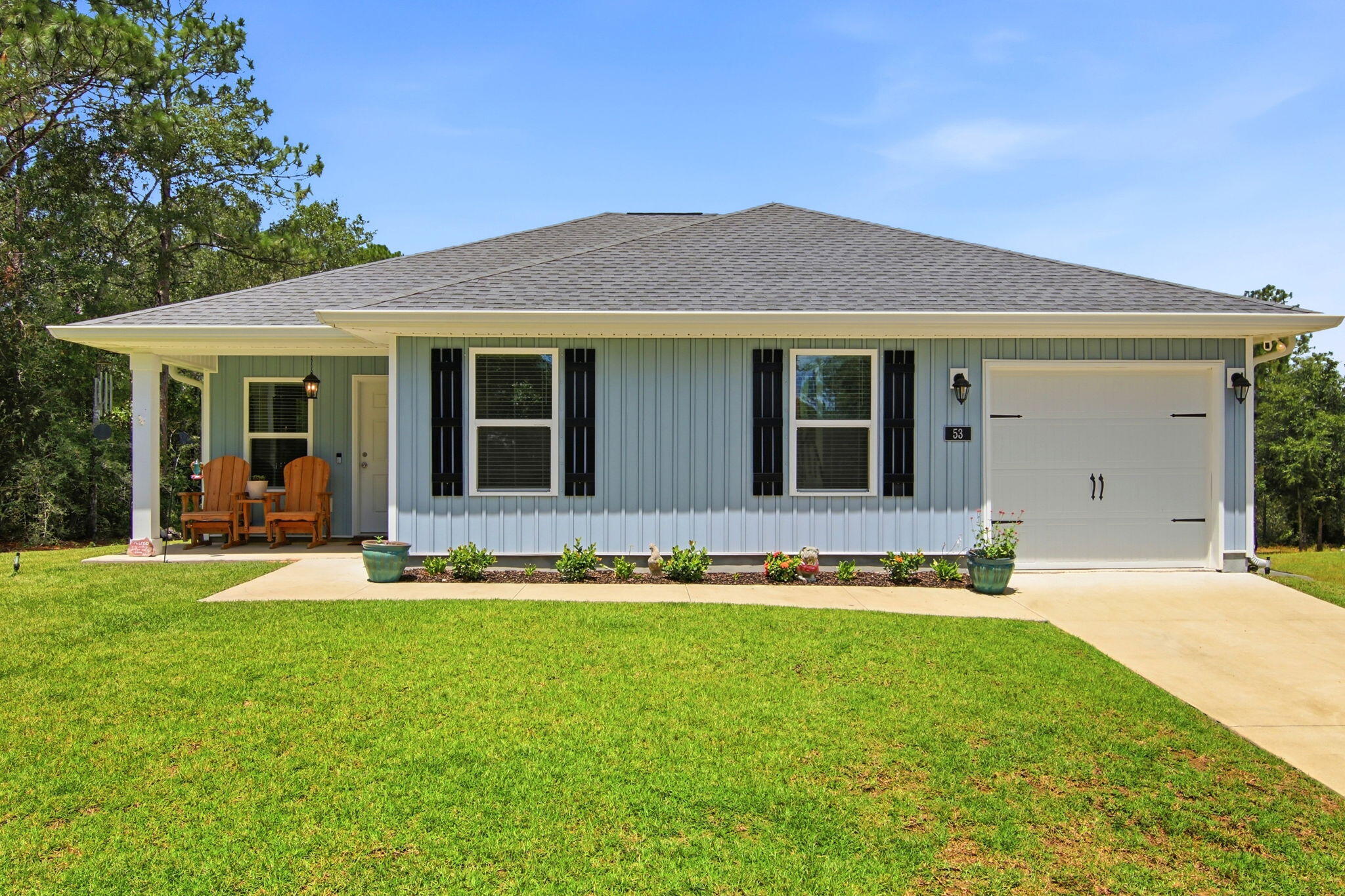 Welcome to this better than new, impeccably maintained home by single owner on just under a half acre in the Juniper Trace neighborhood! With coffered ceilings in family room, this open floor plan home feels spacious, bright, and welcoming. Residents will enjoy numerous tasteful upgrades to include vinyl flooring throughout,  spacious deep pantry with shelving, granite countertops, recessed lighting, updated trim package on all cabinets, windows, and doors, ceiling fans in all bedrooms and main living area, 3 spacious walk in closets, and a generously sized primary bathroom with dual vanities and a oversized/deep tub/shower combo. Situated on the back of a nearly half acre lot sits a 12 x 24 shed tied down with hurricane straps. Plenty of additional space to add your own fire pit, vegetable garden, or additional storage for boats, trailers, or camper! Plenty of custom shelving in garage for your storage needs. See premier series list in Documents for complete list of upgrades.