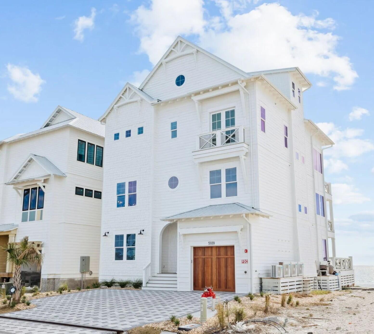 Discover a rare opportunity to own a newly constructed Gulf-front estate in the coveted Hadley's Beach community. Spanning 5,891 square feet across four levels, this professionally furnished residence was designed with a balance of scale, sophistication, and livability. Featuring nine bedrooms, eleven bathrooms, a bunk room, and a private Gulf-front pool, the home embodies the essence of luxury coastal living.