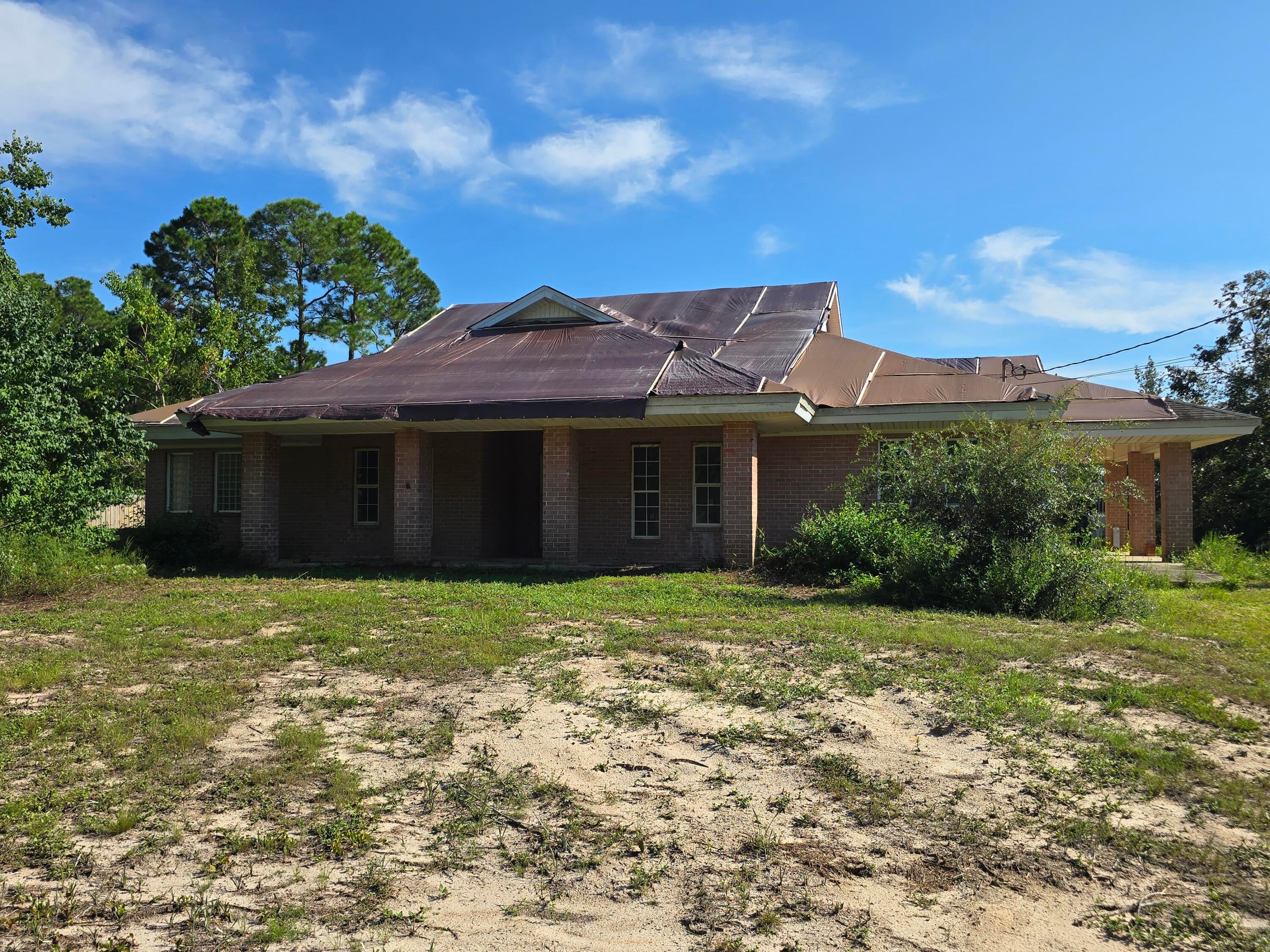 FORECLOSED PROPERTY. Opportunity awaits! This 3 bedroom 2 1/2 bath brick home is ready to be restored to its former glory! Situated on nearly a half acre lot and just a few miles from the white sands of Navarre Beach. This is the challenge you've been looking for!