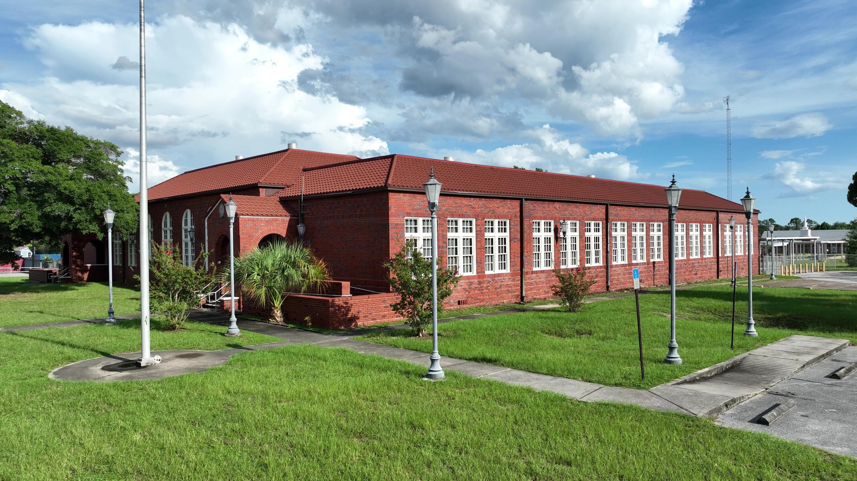 The St. Andrew School (also known as the St. Andrew Grammar School) is a historic site in Panama City, Florida. It is located at 3001 West 15th Street. On August 14, 1997, it was added to the U.S. National Register of Historic Places. It was constructed in 1926 and served as a Bay County school until Hurricane Michael damaged the buildings in October of 2018. In 2021, the city proposed turning the facility into a community center to include arts, culture, and events venue. A new Decra Roofing System (ceramic coated steel shingles) was installed in 2025. The total square footage is +/-23,387 square feet of heated and cooled space. The original school building (built in 1926) is +/-17,074 and the cafeteria and library building (built in 1957 is +/-4,760 square feet. There are several storage buildings and a large pole barn. The property is an entire block bordered by W. 15th Street on the north side, Beck Avenue on the east side, W. 14th Street on the south side, and Bayview Avenue on the west side. Located in the City limits of Panama City and currently zoned Public Institutional. The County, Panama City, and the residents prefer to save the original building and renovate for a new use. We are looking for creative investors and developers who have a vision to repurpose the property. Potential uses include, but are not limited to: cultural center, entertainment, special events, church, medical office, assisted living, professional office suites, schools (subject to approval)-  performing arts, trade school, The St. Andrews community is thriving with many new shops and restaurants opening over the past several years. The St. Andrews School property is one of the last pieces of the puzzle that needs a new purpose.