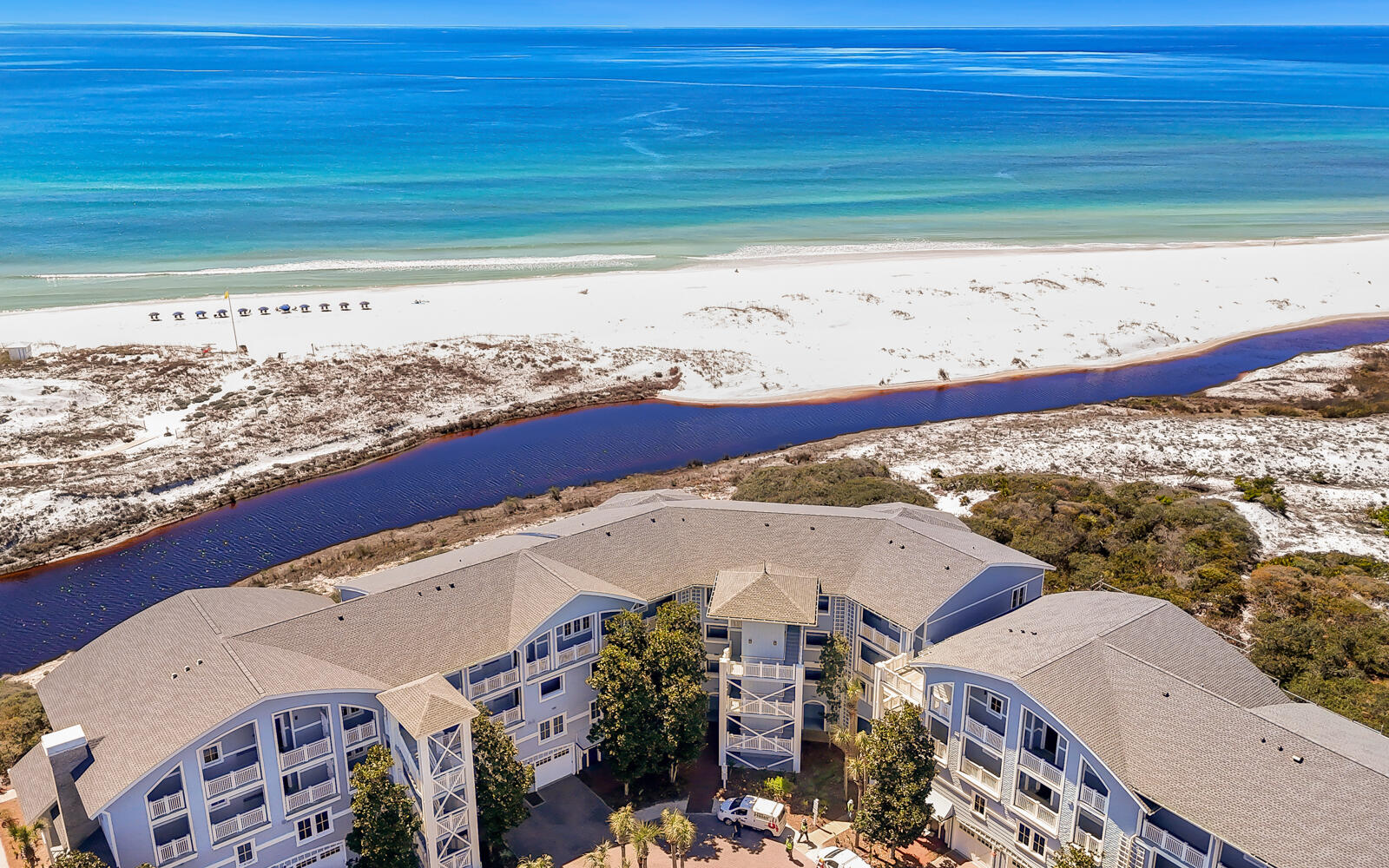 This beautiful three bedroom, three and a half bath residence in The Crossings at Watersound offers a rare opportunity to own in one of the most sought-after condominium communities along Scenic 30A. Opportunities here are few and far between, and it's easy to see why. From the moment you step inside, you're greeted by breathtaking Gulf views paired with the serene backdrop of rolling dunes. Designed for effortless one level living, the split bedroom layout provides both privacy and comfort, and despite being a condominium, the spacious design makes it feel more like a private coastal home. Wood floors run throughout the main living areas and bedrooms, with tile in the bathrooms for durability and style. The open concept living space showcases the stunning scenery with large windows that flood the home with natural light and frame the panoramic views. Just beyond the living area, a generous covered balcony invites you to relax and take in the Gulf breezes, creating the perfect setting for morning coffee or evening sunsets. The kitchen is ideal for the at home chef, featuring abundant cabinetry, expansive countertops, a breakfast bar for casual dining, and a gas range for precise cooking. Each of the three bedrooms includes its own private bath, offering comfort and convenience for family and guests alike. The southern facing guest suite enjoys direct access to the covered balcony overlooking the Gulf, while the primary suite, located on the opposite side of the residence, also opens to the balcony. The primary bath is designed for relaxation, complete with a walk-in shower featuring floor-to-ceiling tile, a separate soaking tub, and a spacious walk-in closet.
Located just one level above the ground floor, the unit offers easy access by stairs or by elevator, which is conveniently situated just around the corner from the front door.
Residents and guests of The Crossings at Watersound enjoy access to the exceptional amenities of the gated Watersound Beach community, including a private beach with boardwalk access, resort-style swimming pool, a state-of-the-art fitness center, scenic walking and biking trails, and beautifully maintained green spaces that blend seamlessly with the natural dune landscape. This is coastal living at its finest. Private, peaceful, and perfectly positioned along the Gulf.