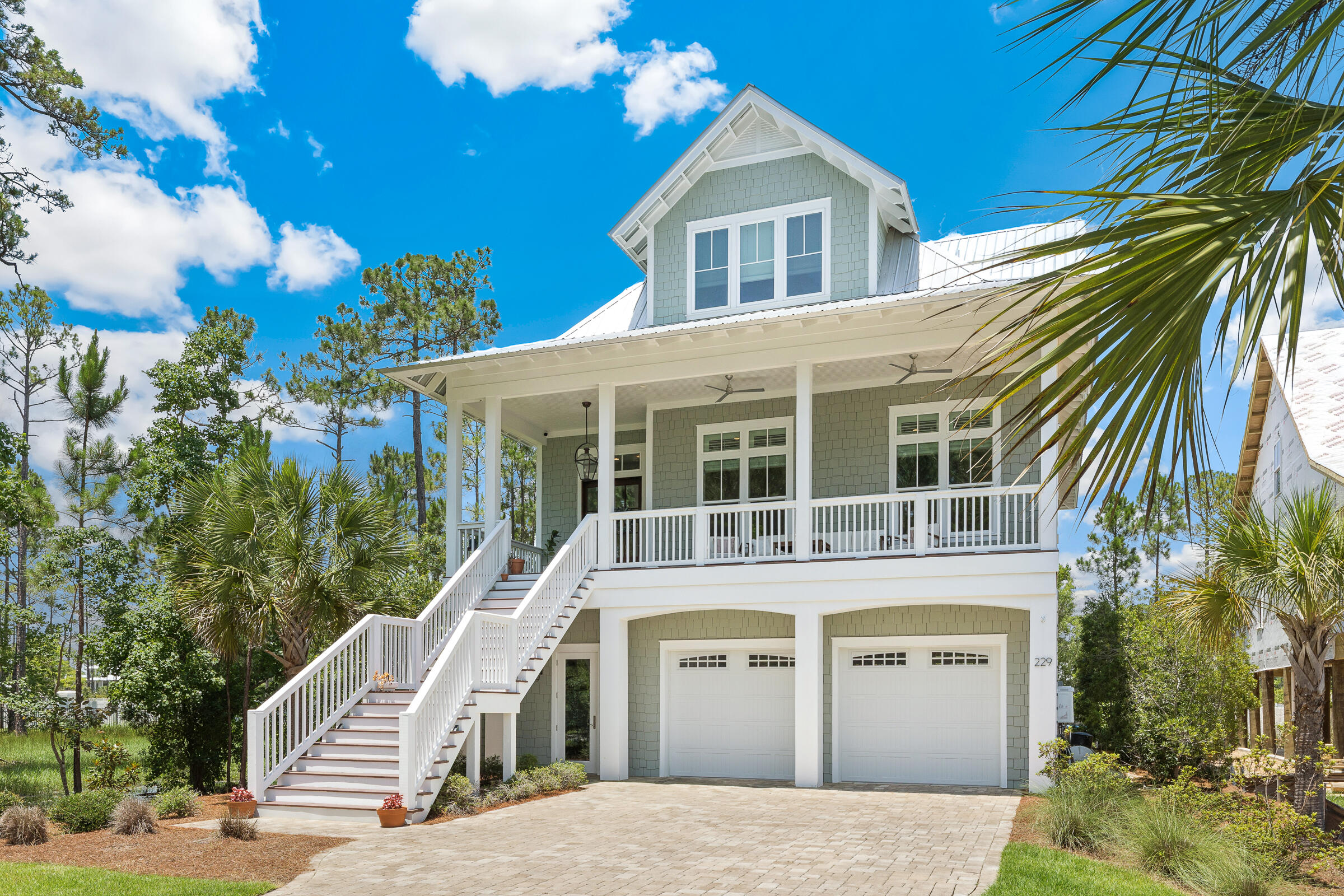 BRING A BACK-UP CONTRACT! This property is under contract but contingent on buyer selling their home.  Seller accepting back-ups.   
This gorgeous custom designed/built home in the small, gated, waterfront community of Cessna Landing is available for new ownership. This stunner features four bedrooms, and three and a half baths. The first/ground level garage has room for four vehicles, plus plenty of storage. Entry foyer off the garage offers ''sand'' room collection area for shoes, boots, jackets, etc. Custom features include 12 ft. ceilings on the second/main living level, 10 ft. ceilings on the third level, and crown molding and white-oak hardwood floors throughout. Bathrooms each have tiled floors and showers with rimless glass doors, while the master bath also has a free-standing soaking tub. Numerous and oversized windows flood the house with natural light. Eight-foot mahogany doors, custom cabinets, high-end appliances, a gas fireplace, and surround sound in the living area and master bedroom all highlight the overall charm and quality of this home. Three stacked closets could be converted back to the original design for an elevator. Several porches and decks- both open and screened offer additional outdoor living spaces. If ever a home was designed for entertaining, it is this one! Additional highlights include access to the community pool and the bay, as well as stunning bay views and sunsets.  And... And launching your boat is easy with Cessna Landing boat ramp just across the bridge, and beach access is a quick four miles away