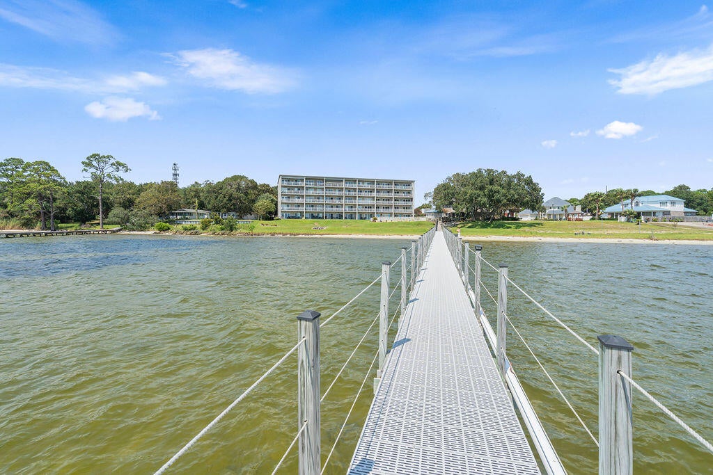 WELCOME HOME to this beautiful WATERFRONT condo located on the Sound in Mary Esther in a gated, non-STR community. Fully renovated a few years ago, this unit is in a building of only 40 units and makes for the perfect home or vacation home! Located just a few miles West of Hurlburt Field, and perfectly centered between FWB and Navarre for all of your shopping and dining needs. Enjoy your morning coffee or evening sunset on the patio overlooking the Sound or on the private lawn/beach area with your feet in the water, watching the dolphins swim by and boats cruising through. Enjoy the pool and hot tub year round and watch all the fun on the water.
The recreational lot next door is a shared lot between the Intercoastal Pointe HOA and the neighborhood next door - fun for the whole family/guests to play and have a barbecue. These units don't hit the market very often, so now is your chance!
HVAC - 2018
Water Heater - 2018