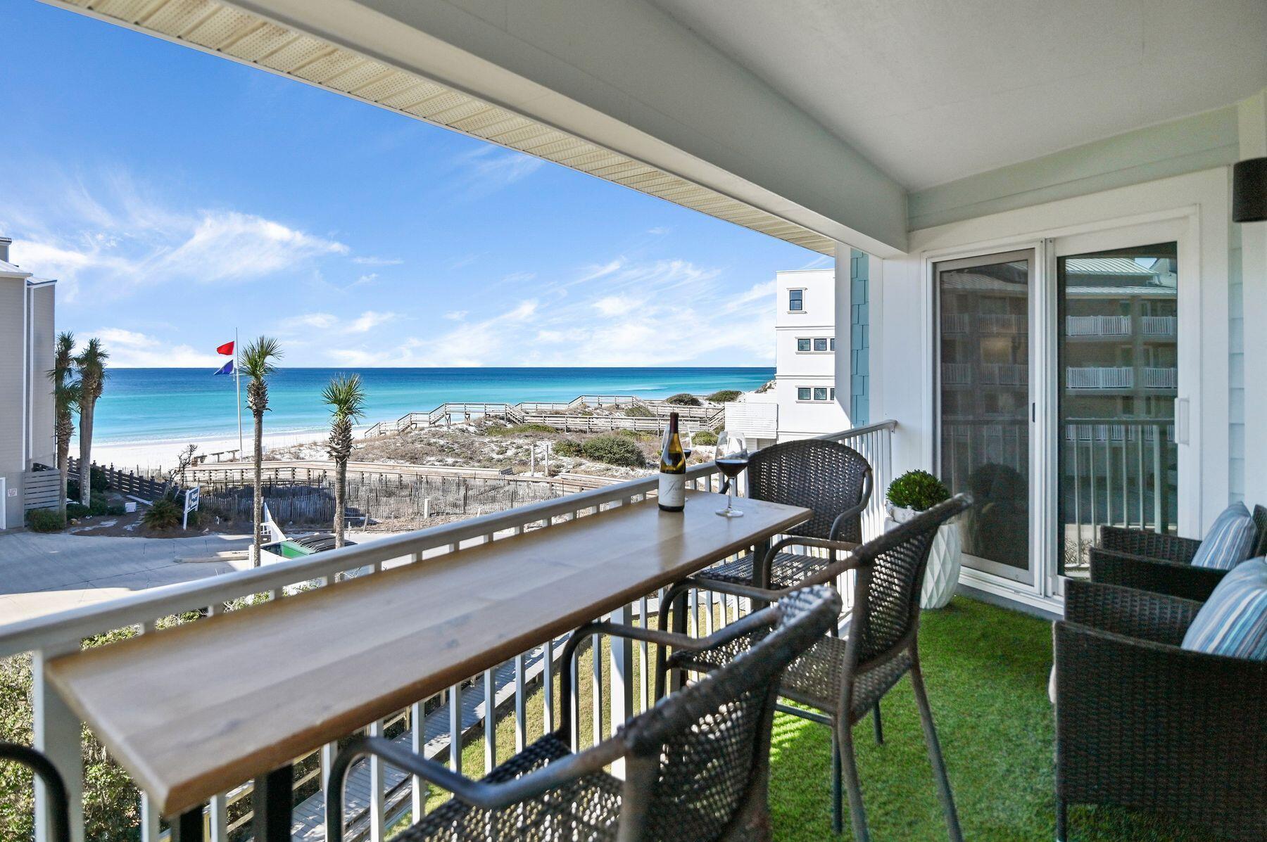 Just steps from the beach, this beautifully updated condo offers gulf views and elevated coastal living. Fully renovated in 2022 with a new roof, windows, doors, and siding, the residence features a spacious living area and primary suite with stunning gulf views. Designer details include custom drapes, Parisian fabrics, Lee Jofa wallpaper, Visual Comfort lighting, and furnishings from Beau Interiors, Serena & Lily, and Le Château European Interiors. The gourmet kitchen features waterfall-edge quartz countertops, stainless steel appliances, and a stylish buffet/bar area. An expansive balcony provides the perfect setting for outdoor dining and enjoying the gulf breeze. Three well-appointed bedrooms and two updated baths feature marble vanities, subway tile, Kohler fixtures, and statement lighting. Resort-style amenities include a seasonally heated pool, tennis and pickleball courts, shuffleboard, lake access, and shuttle service to nearby beach access. This turnkey gulf-view retreat offers exceptional updates, thoughtful design and desirable resort-style amenities.