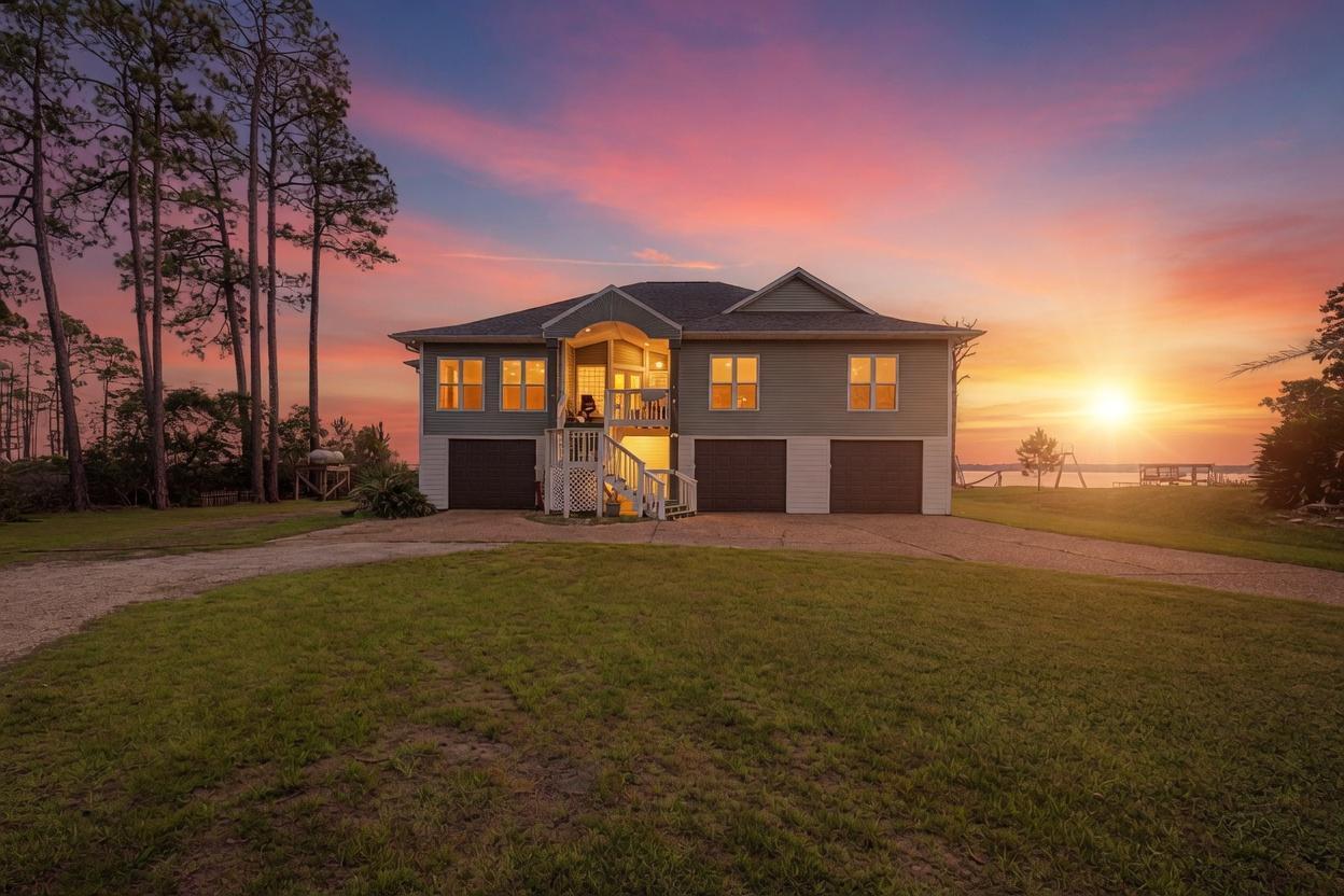 Waterfront Luxury with Panoramic Bay Views on Nearly an Acre. New Roof June of 2026. 

Experience exceptional waterfront living in this beautifully updated 4-bedroom, 3-bathroom home offering 3,305 square feet of living space on a private 0.90-acre lot. Designed to maximize natural light and breathtaking views, the home features expansive windows, light interior finishes, and a flowing open-concept layout that seamlessly connects the main living areas.

The spacious kitchen is equipped with modern conveniences, including a tankless water heater and propane gas service. Thoughtfully designed bedrooms provide privacy and comfort, while bamboo flooring in the bedrooms and new tile throughout the main living areas add warmth and style.

Enjoy year-round relaxation in the indoor lap pool overlooking the bay, complemented by a covered lanai, screened deck, and open-air entertaining spaces. The impressive two-story sun deck sits above the boat lift, creating the perfect vantage point for taking in panoramic water views and spectacular sunsets.

Boating enthusiasts will appreciate direct water access, a kayak launch, and two boat lifts--one designed for a powerboat and a second larger lift suitable for a sailboat or larger vessel. Significant infrastructure improvements include connection to sewer with a commercial-grade grinder system, complete removal of previous septic tanks, lines, and mounds, and the addition of a gravel driveway.