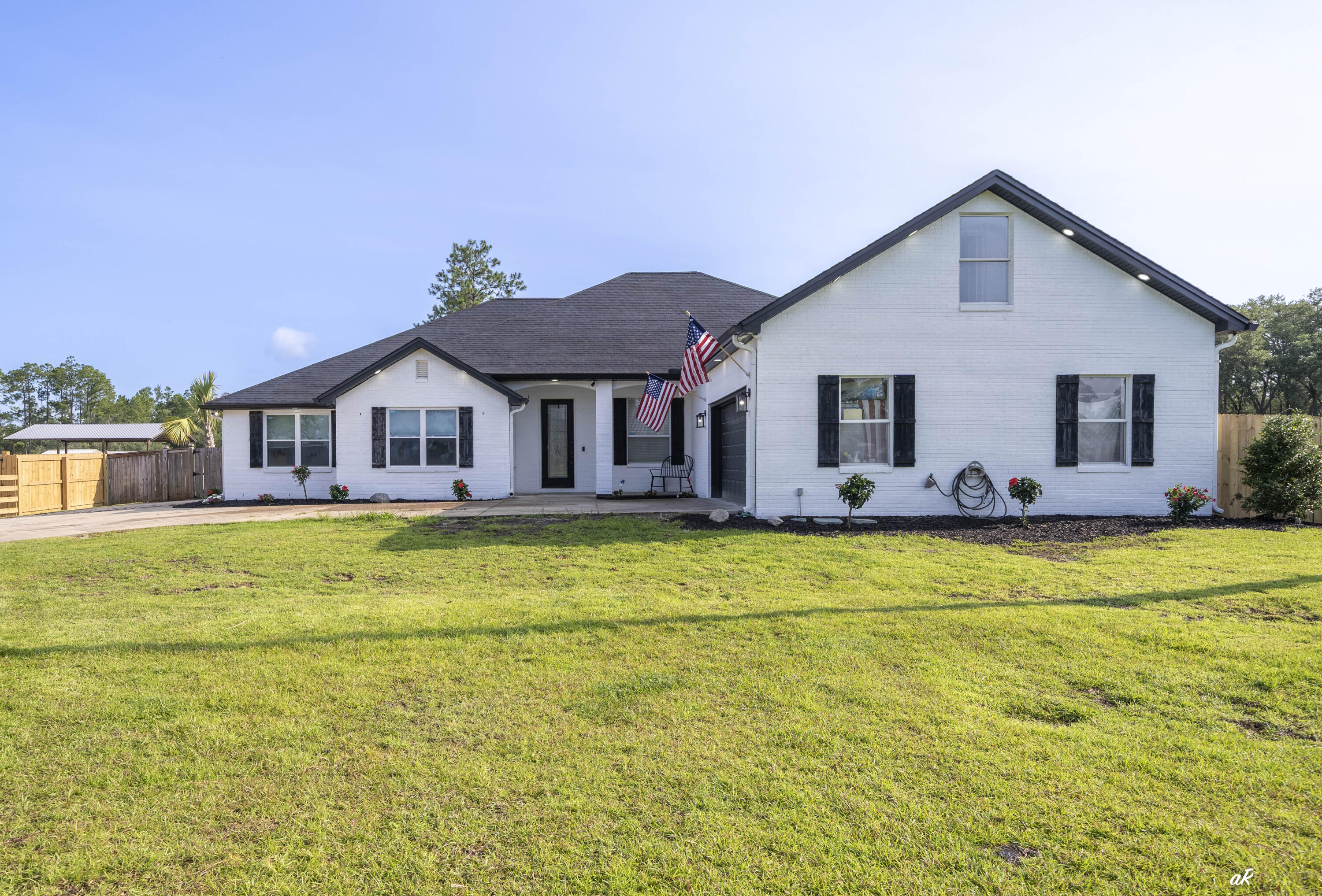 221 White Oaks Boulevard, where you can enjoy the space and freedom that draws so many people to Southport while still being just minutes from Lynn Haven, Panama City, and Panama City Beach. Situated on 3 acres across two parcels with frontage on both White Oaks Boulevard and Skunk Valley Road, this property offers flexibility that's hard to find. The approximately 4,000-square-foot home features 5 bedrooms, 2 bathrooms, multiple living areas, a formal dining room, an eat-in kitchen, a bonus room, and recent updates including flooring, appliances, and other interior improvements. Highlight- possible to split and make two separate properties, one on White Oak and one on Skunk Valley with two separate dwellings! Step outside and you'll quickly see what makes this property special. The backyard is set up for enjoying the outdoors with an in-ground pool, hot tub, outdoor kitchen, cabana, fire pit, basketball court, outdoor shower, pool bath, and a playhouse. Need room for projects, toys, or a business? The approximately 4,000-square-foot shop includes a vehicle lift and offers plenty of space for equipment, storage, hobbies, or a home-based business. The property also includes two separate one-bedroom apartments, providing excellent rental or guest accommodations, plus an RV site with full hookups for visitors or additional income potential. A private gym adds even more versatility. With no HOA and room to spread out, this is the kind of property that's becoming increasingly difficult to find. Whether you're looking for space for your family, a place to run a business from home, room for all your hobbies, or a property with built-in income opportunities, this one checks a lot of boxes. If you've been looking for country living without feeling isolated, you'll appreciate the location. Enjoy the peace and privacy of Southport while staying just a short drive from Lynn Haven, Panama City, boat ramps, shopping, restaurants, schools, and the beaches.Properties with this much land, this many improvements, and this level of versatility rarely come available. Schedule your private showing today.