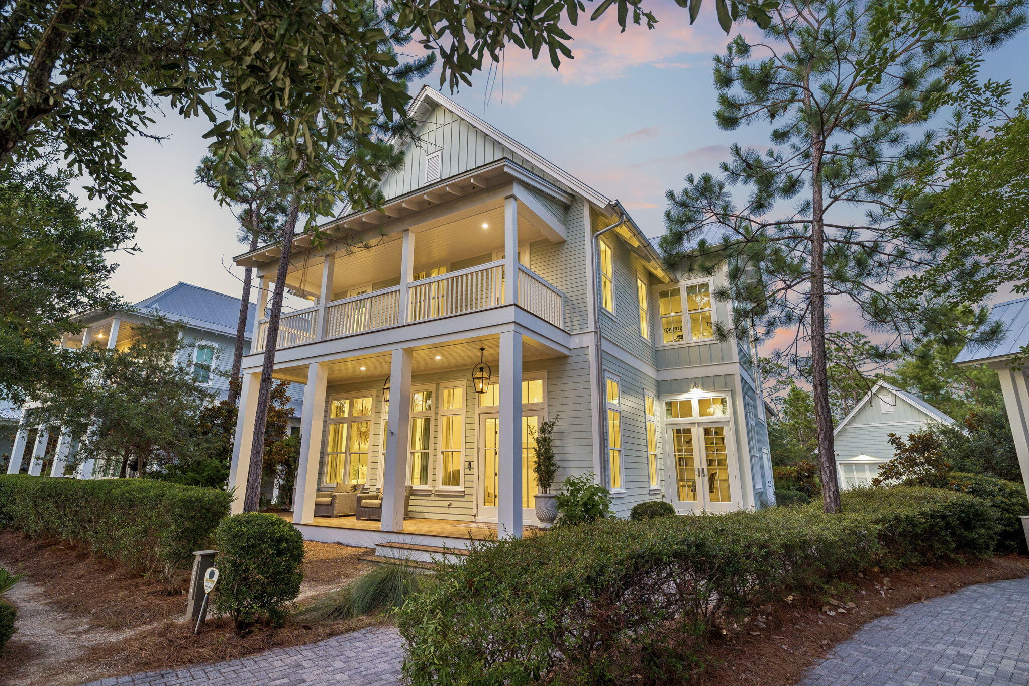 This five bedroom custom-built coastal compound does more than welcome you home -- it creates a legacy.
This home was custom designed by Romair Development Group and its one-of-a-kind finishes throughout make it one of the standouts in all of Watercolor!
An indoor fireplace centers the great room with warmth and style, while the open-concept design leads to a dream kitchen with Sub-Zero appliances and an inviting dining area made for weekend gatherings.
Three luxury primary suites offer guests resort-style comfort and privacy, while a seperate  bunk room gives children a fun and inviting space of their own.
An enclosed office with cascading natural light  creates a private retreat for work, study, or quiet focus.   The home blends sophisticated technology with effortless comfort, featuring a Control4 smart home system and automated lighting throughout. 
Just beyond the doors, the outdoor living takes center stage!  A shimmering, heated pool invites long afternoons in the sun, while a private cabana, fireplace, and television set the scene for relaxed evenings year-round.   The outdoor living goes beyond again with an extraordinary kitchen that sets the stage for year-round entertaining, while spacious porches surround the home with large-screen TVs, swing beds, and beautifully designed areas for relaxing and gathering.
Behind the home, a protected nature preserve wraps the property in peaceful quietude and delivers a rare sense of privacy. Offered fully furnished, this extraordinary residence delivers a rare opportunity to own in WaterColor, one of 30A's most desirable communities. Don't miss the chance to make it yours.