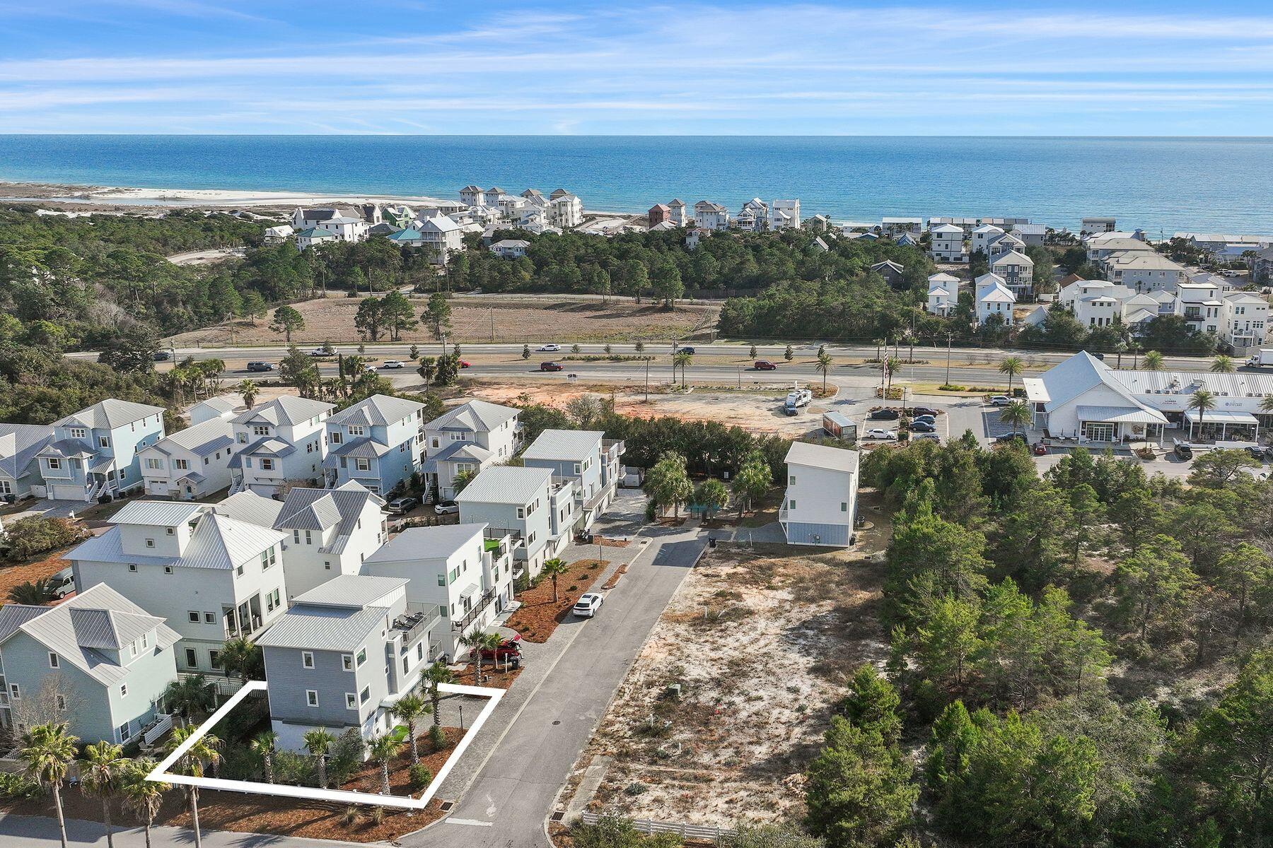 Just minutes from the white sand in Inlet Beach, this beautifully designed three-story coastal retreat offers the ultimate 30A lifestyle. Enjoy seven nearby public beach access points with parking and restrooms, the closest being access beside Camp Helen State Park, where the beach is wide open and less crowded. The new Highway 98 pedestrian underpass also provides safe, convenient access to both the beach and 30A, making this an ideal vacation getaway or investment property.  Built in 2018 and recently refreshed, this four-bedroom, four-bathroom home spans 2,196 square feet and comes turnkey and fully furnished, complete with a six-seat golf cart. Thoughtful updates include new exterior paint, wainscot in stairwells, new balcony decking, and new flooring on the second level, ensuring a move-in-ready experience. Inside, you'll find two living areas designed for comfort and entertaining. The first floor offers a cozy living space with a three-bunk bedroom, full bath, laundry, and patio access. The second floor includes an open-concept kitchen, living, and dining area with a balcony, plus a guest bedroom and full bath. The third floor hosts the primary suite with double vanities, walk-in closet, walk-in shower, and sun deck, along with an additional ensuite bedroom with deck access. This stylish home comfortably sleeps 11 or more guests and offers multiple outdoor spaces, including a balcony, deck, a fenced backyard patio, and low-maintenance artificial turf, making it easy for coastal living. Soak up the sun at the community pool shared by only a few homesites, bike to 30A , and enjoy the convenience of a rare two-car garage plus driveway parking for two to three additional vehicles. Stroll to nearby dining, boutiques, and cozy coffee shops, or take a quick bike, golf cart, or car ride to 30Avenue for even more shopping, dining and entertainment. With impressive rental projections of $65,000 to $97,000 annually, this turnkey beach retreat offers the perfect blend of smart investment potential and effortless coastal living. Discover the charm, convenience, and laid-back luxury that make Inlet Beach so special.  Buyer should verify all data and approximate dimensions, if important.