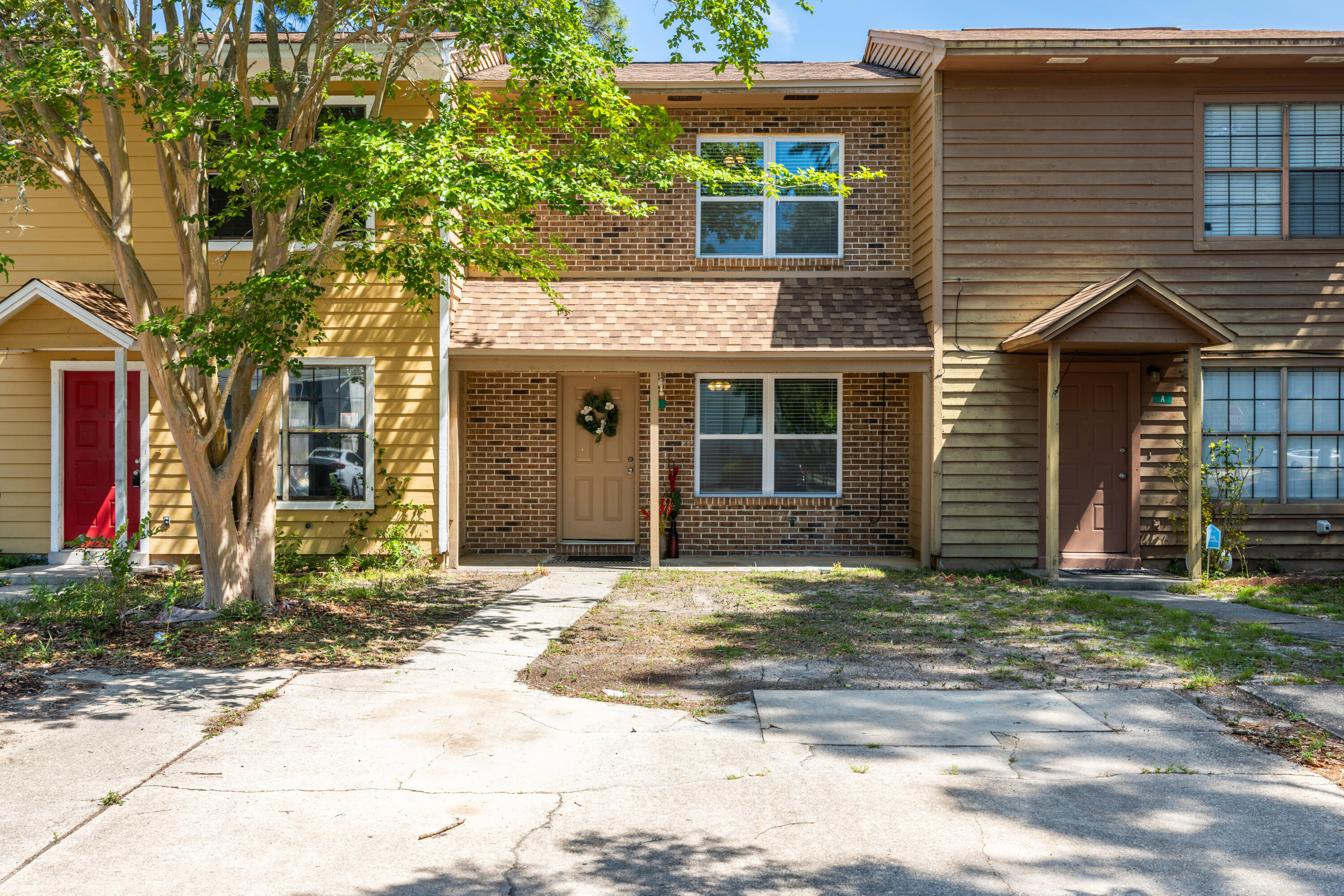 This townhome is the synergy of simple and comfort. It's nestled perfectly for quick access to the beach, shopping and downtown. Other highlights include: a new roof, new windows, fresh paint, large backyard with new privacy fencing and new carpet. It's ready for NEW owners. AC less than 5 yrs old
