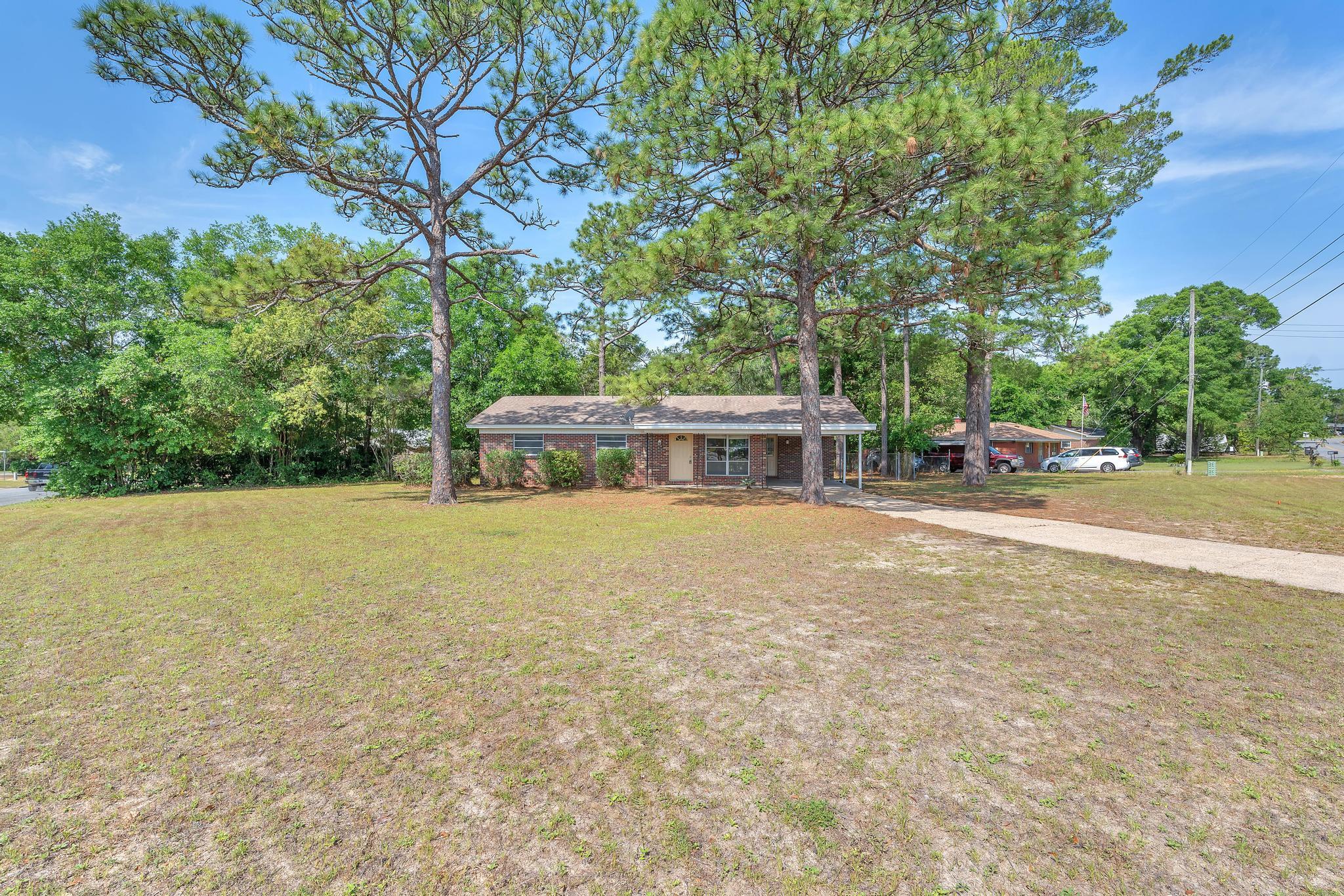 Welcome to this charming 3-bedroom, 2-bathroom home ideally located in the heart of Valparaiso with convenient access to Eglin Air Force Base and the highly sought-after Niceville School District! Filled with natural light and full of character, this inviting home offers a warm and comfortable atmosphere from the moment you step inside.

The updated kitchen features beautiful granite countertops and breakfast bar, perfect for cooking, entertaining, and everyday living. A spacious dining area provides plenty of room for gatherings, while the large separate laundry room adds extra convenience and storage space.

Situated on an oversized corner lot, this property boasts a large wrap-around porch and generous front and backyard spaces, ideal for relaxing outdoors, gardening, or entertaining guests.

The primary suite includes a private ensuite bathroom with a walk-in shower, while the additional family bathroom features a convenient shower/tub combo.

Don't miss your chance to make this wonderful home your own. Contact us today for a showing!