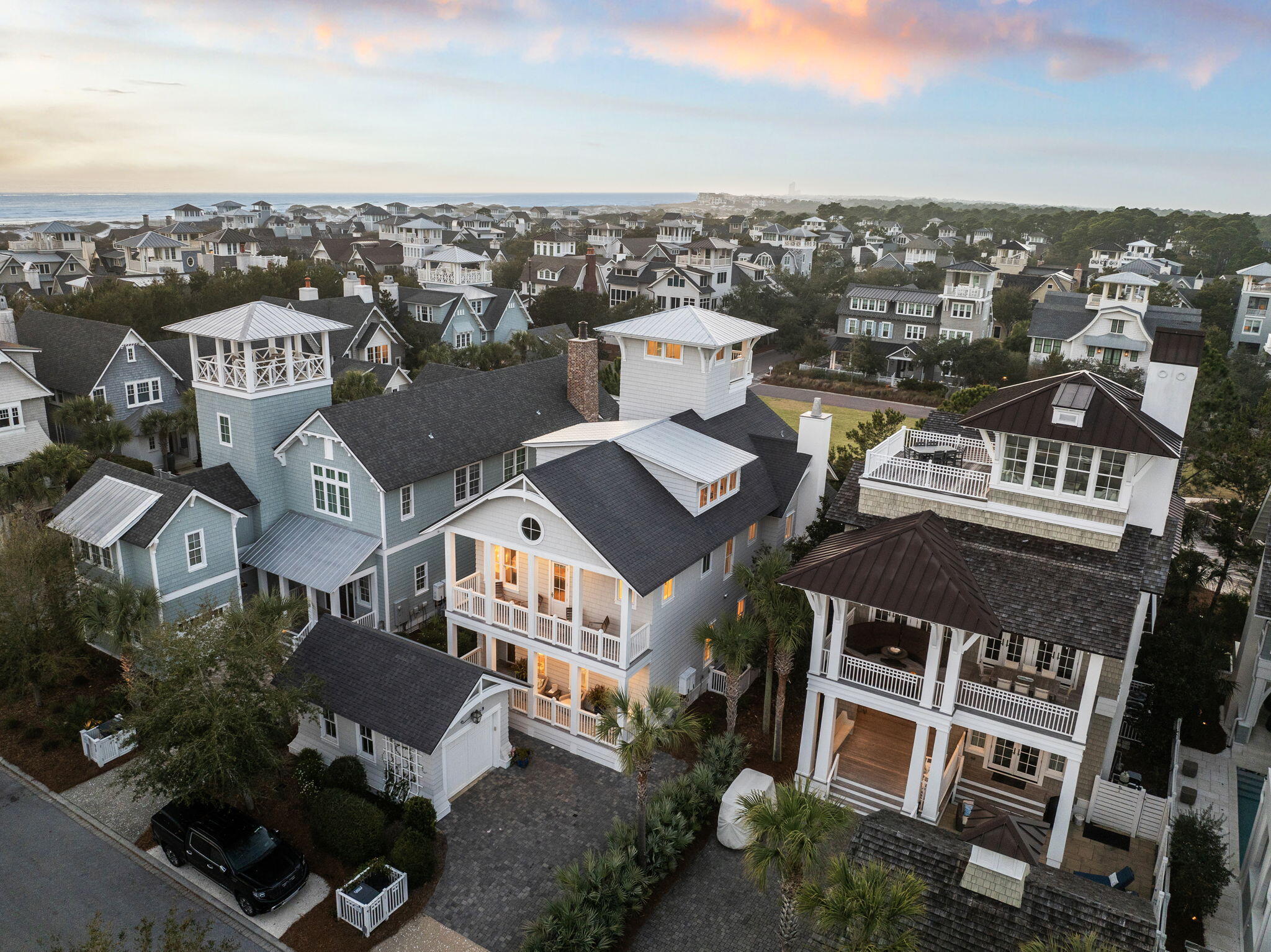 Positioned steps from the sugar-white sands of the Gulf, this exceptional Watersound Beach residence commands attention across four thoughtfully designed floors. Built in 2017 and encompassing 4,230 square feet, the five-bedroom, five-and-a-half-bath home is a masterclass in refined coastal living - where soaring ceilings, crisp white interiors, and a white brick fireplace create an atmosphere of effortless sophistication.

The chef's kitchen is appointed with richly veined marble countertops and a full suite of Thermador appliances, including a six-burner gas range and double oven. Two generous primary suites, including a first-floor retreat, offer the privacy and serenity expected of a home of this caliber. A dedicated bunk room and third-floor game room with oversized screen speak to thoughtful design for gathering and entertaining at every level.

Outside, a private pool and landscaped rear yard provide a serene escape, while the fourth-floor west-facing lookout tower reveals sweeping panoramic views of the Emerald Coast. Dual full-width covered porches invite unhurried mornings and golden-hour evenings alike. A detached garage and paved driveway complete the offering with ease and practicality.

Within the gated Watersound Beach community, residents enjoy an unrivaled amenity collection featuring multiple pools, a private fitness center, miles of scenic boardwalks, a dog park, and one mile of deeded Gulf beach access. Short-term rentals are permitted, presenting a rare opportunity to own a premier primary residence, second home, or income-producing asset along one of Florida's most sought-after coastlines.
