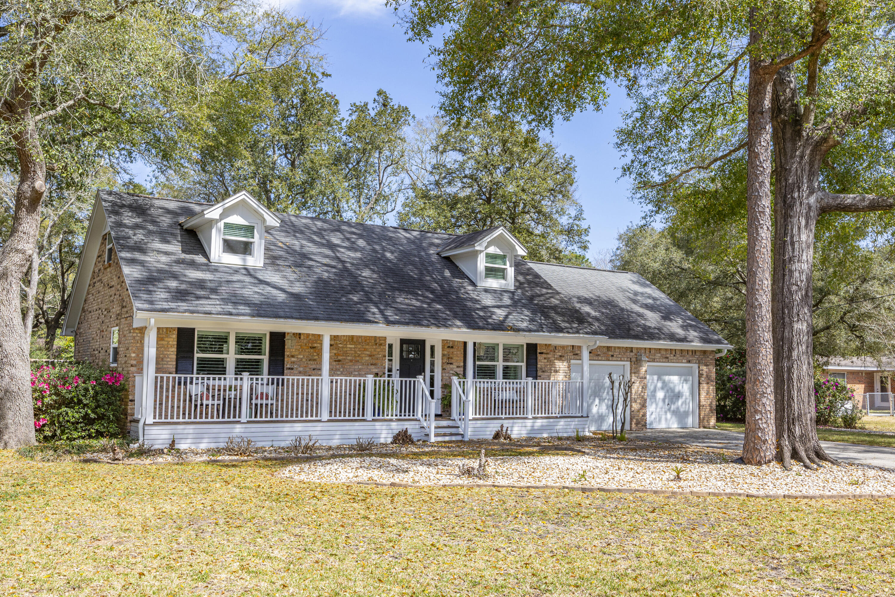 3 bed/2.5 bath home on .35 acres in the highly desirable Kenwood Subdivision.  This beautifully renovated home offers the perfect blend of comfort, and functionality.  Mature hardwood trees provide shade across the home with a paver brick walkway leading to a welcoming front porch.  Inside, the bright open floor plan features LVP flooring, high ceilings and recessed lighting.  A spacious living room with a cozy fireplace and custom built-ins creates an inviting gathering space. The chef's style kitchen is designed for both everyday living and entertaining, complete with Bosch appliances including a double oven and French door refrigerator, custom gray Shaker-style cabinetry, and quartz countertops.  The first-floor primary suite includes a stunning custom bath with a sliding barn door, featuring gray cabinetry, dual vanities, an oversized glass-enclosed shower, and a freestanding soaking tub. Two additional bedrooms and full bath are located upstairs.  Outdoor living is exceptional with a screened-in enclosure surrounding the Gunite saltwater pool, with waterfall feature. The fenced backyard also includes a large wooden deck, perfect for weekend barbecues, plus plenty of lawn space.  A bonus room above the garage could be used as a home office, playroom, or guest quarters.  This home is move-in ready and conveniently located near beaches, bay access, schools, shopping, golf, Fort Walton Beach Medical Center, and just five miles from Eglin Air Force Base.