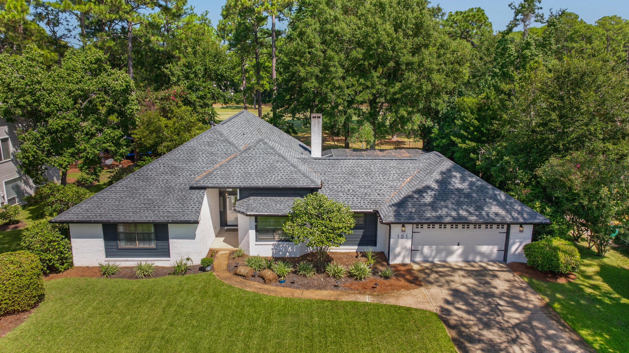 SELLERS OFFERING $10,000 CREDIT! Welcome to Southwind, a gated Bluewater Bay community where golf course living meets the charm and hometown feel that make Niceville so special. Perfectly positioned minutes from the Mid-Bay Bridge for easy access to Destin and the beaches, or head the opposite direction for a quick drive to Eglin AFB. Local restaurants, shops, & incredible small businesses are all close to home. Beautifully renovated inside and out, this home has been thoughtfully transformed for both everyday living and entertaining. The fully remodeled kitchen anchors the home with updated cabinetry, countertops, appliances, and finishes, opening into spacious living areas with soaring vaulted ceilings and abundant natural light. All bathrooms have been remodeled, along with updated landscaping & custom exterior lighting. Generously sized secondary bedrooms share an impressive Jack-and-Jill bath with TWO separate toilet rooms for added privacy and function. The oversized primary suite feels like a true retreat with a large walk-in shower, freestanding soaking tub, dual vanities, and an expansive walk-in closet.
A large flex space currently serves as an office with access to a half bath, while the showstopper is an incredible entertaining lounge with a garage-style slide-up door opening directly to the covered pool. Enjoy seamless indoor/outdoor living, a beautifully landscaped backyard, and peaceful golf course views. An exceptional home & an incredible Southwind lifestyle!