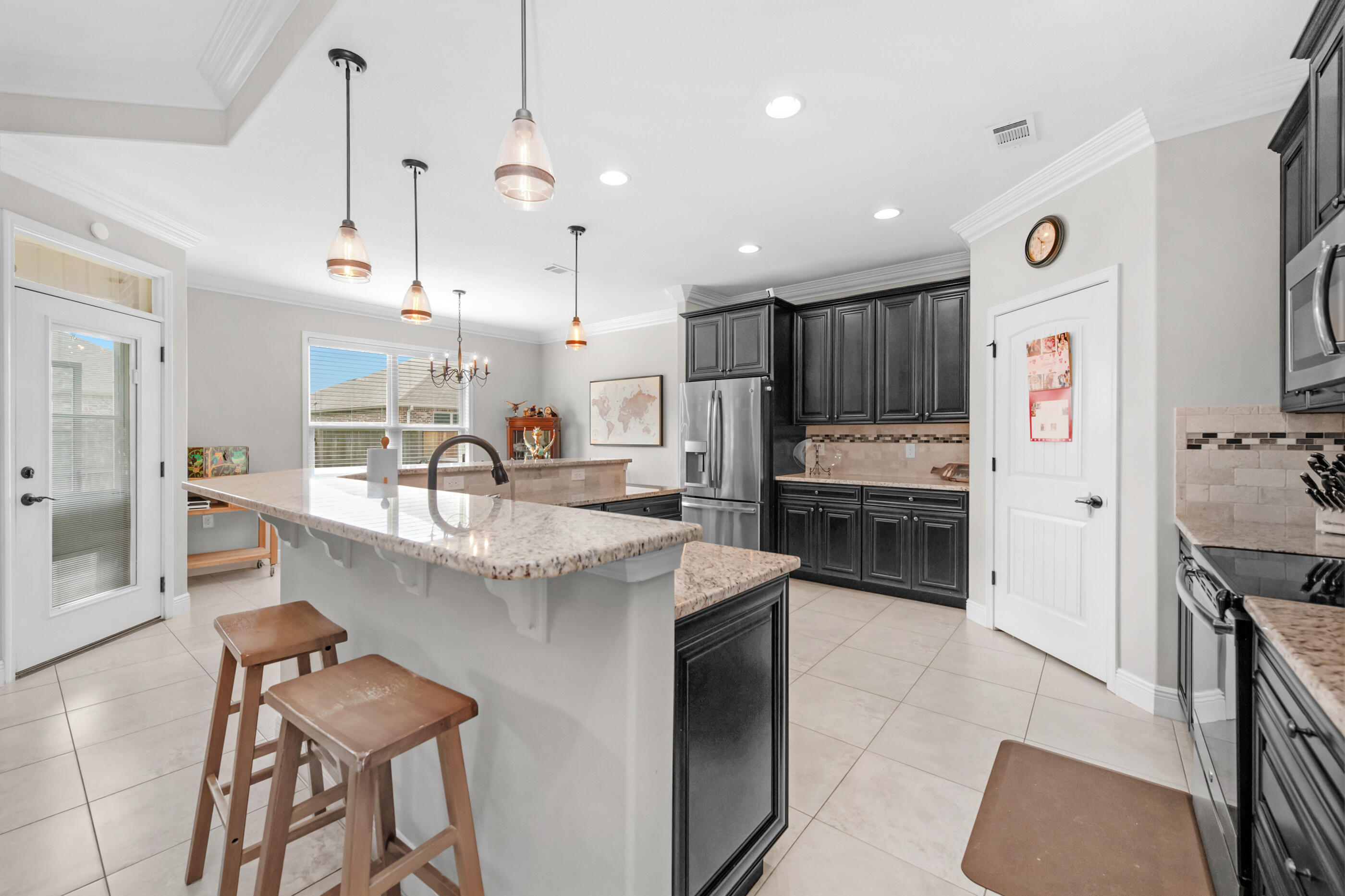 Welcome to 2394 Ellison Way in Fort Walton Beach, Florida -- a beautifully designed custom home offering 4 bedrooms, 2.5 bathrooms, and a spacious open floor plan perfect for modern living along the Panhandle of Florida.
This move-in ready home features a large open concept layout ideal for entertaining, with granite countertops, stainless steel appliances, a generous breakfast bar, and seamless flow between the kitchen, dining, and living areas. Whether you're hosting friends for the game or enjoying a quiet night in, there's plenty of space to gather.
The oversized owner's suite is a true retreat, complete with a large walk-in closet, double vanity, soaking tub, and ample space to unwind after a long day. The additional bedrooms are generously sized, offering flexibility for guests, a home office, or a dedicated home gym.
Custom woodwork throughout the home adds character and craftsmanship, while tray ceilings with LED lighting create an elevated, modern feel. Fresh finishes and epoxy garage floors provide durability and easy maintenance -- perfect for busy military families.
Step outside to a covered patio and fully fenced backyard, offering privacy and room for pets, play, or weekend barbecues.
Located just minutes from Hurlburt Field and Eglin Air Force Base, this Fort Walton Beach home offers a convenient commute while keeping you close to shopping, dining, top-rated schools, and the white sand beaches of the Emerald Coast. You'll be in the heart of it all without the noise and traffic with quick access to local restaurants, grocery stores, and all the coastal lifestyle amenities that make living near the Gulf so desirable.
If you're PCSing to the area or looking for a well-appointed home near base with space, upgrades, and location, 2394 Ellison Way checks all the boxes.