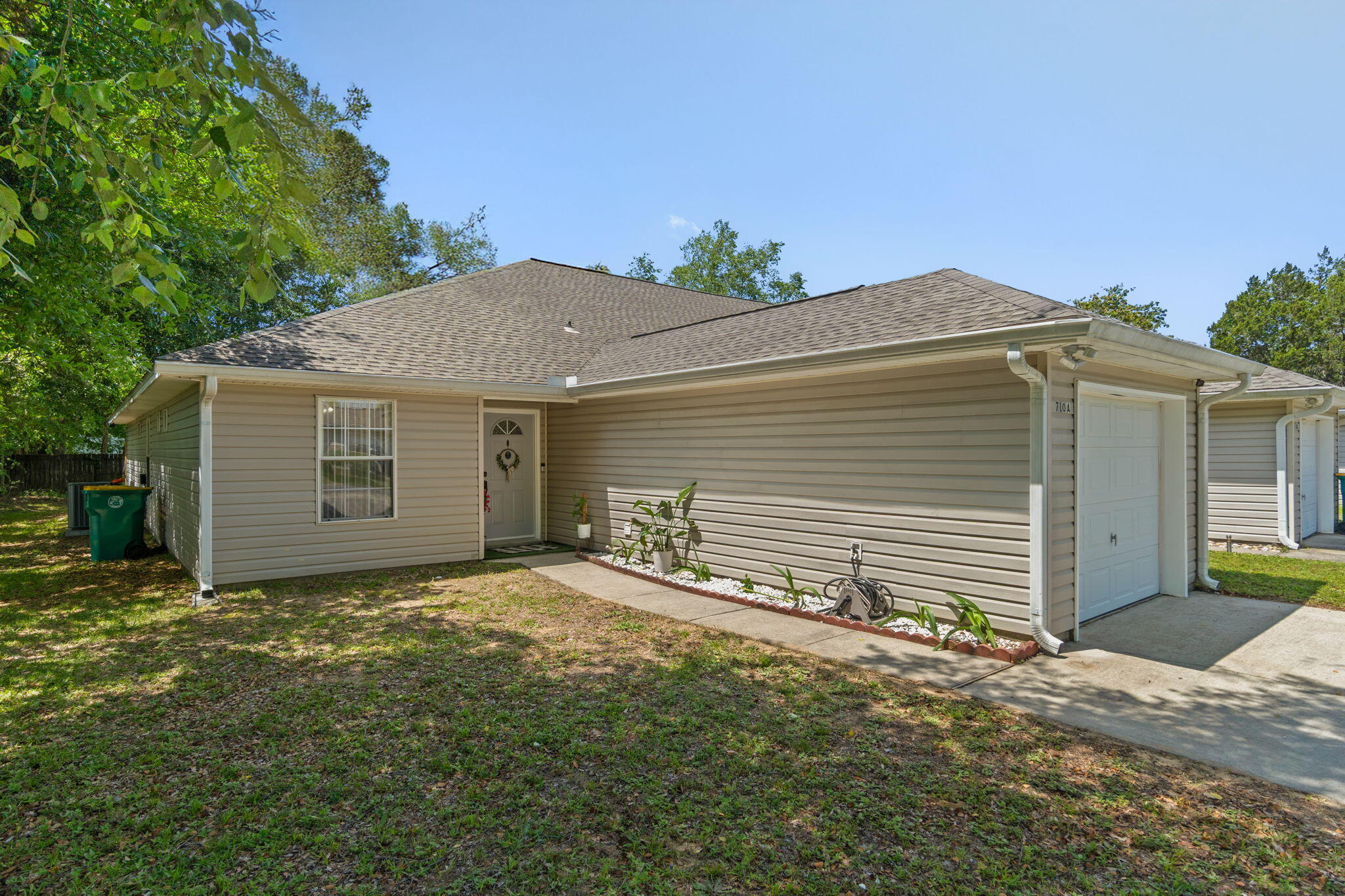 Welcome to this spacious single-story, end-unit townhome in the heart of Fort Walton Beach! Offering 3 bedrooms, 2.5 baths, a one-car garage, this home combines easy living with an unbeatable location. Conveniently situated between Eglin AFB and Hurlburt Field and just minutes from shopping, dining, entertainment, and the sugar-white beaches of the Emerald Coast. Inside, you'll find an open-concept floor plan featuring a spacious living room and adjoining dining area, perfect for everyday living and entertaining. Trey ceilings in both the great room and primary bedroom add architectural charm, while luxury vinyl plank flooring enhances the main living spaces. The kitchen has been thoughtfully updated with a new refrigerator and microwave (2024), dishwasher (2025), and kitchen faucet (2026). The primary suite features a walk-in closet with custom built-ins added in 2025, while the guest bedroom also received custom closet organization in 2024. An interior laundry room with added storage cabinetry provides extra convenience and functionality. Enjoy peace of mind with major updates including a new roof (2023), HVAC system (2019), and water heater (2026). Additional improvements include luxury vinyl plank flooring in the bathrooms and laundry room, updated smoke alarms, new light switches throughout, air duct cleaning, fresh interior paint, and more. Step outside to the screened-in back patio overlooking the newly fenced backyard (2025), creating a private space to relax, grill, or entertain. With end-unit privacy, extensive updates, and a central Fort Walton Beach location close to military bases and the beach, this move-in-ready home is a must-see!