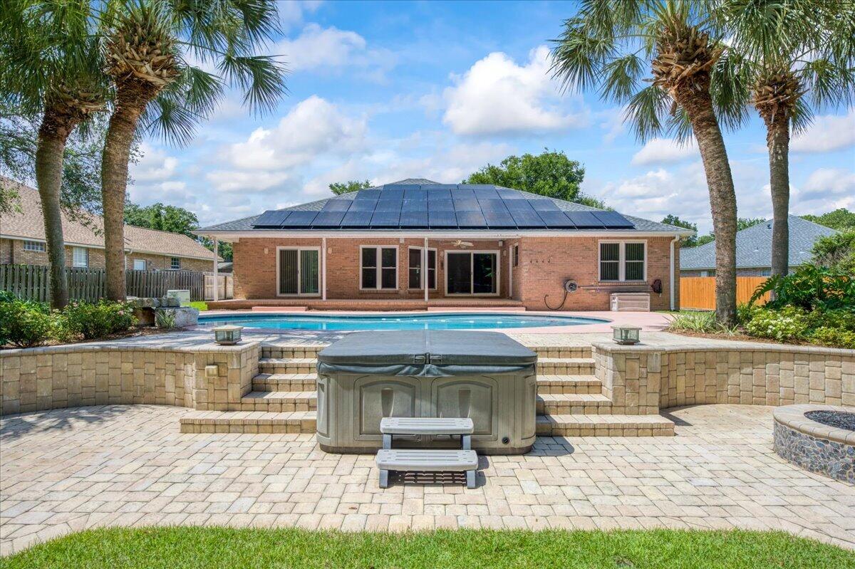 AMAZING POOL HOME located in LONGWOOD/POQUITO neighborhood, One Owner CUSTOM BUILT IN 2000 ALL-BRICK 4 Bedroom, 2.5 Bathrooms with gorgeous Landscaping and your own Backyard Private OASIS! ! House features 20K Gallon Saltwater Pool, 2018 Whole House Generator, 2021 New Roof, 2021 Impact Glass New Windows, 2021 Solar Panels, 2022 New HVAC, Large Hot Tub/Spa, Gas Fire-Pit, Home Security System, Whole House Water Softener System, New LED Pool Light, Side Yard Boat Pad behind double gate for Private parking of your Boat.   Large entryway/foyer leads into large open living room floorplan with tray ceiling, Breakfast bar and Kitchen centrally located, Master Bedroom is on right side of Floorplan and 3 other Bedrooms are situated on left side of Floorplan with one Bedroom having an ensuite Bathroom which also opens to outside Pool/Patio area for convenience, this home is ready to greet its New Homeowners and share all the great features that make this house an excellent choice for its next discerning Buyer!  Great Location 5 minutes to front gate of Eglin AFB and 10 minutes to Local Airport.  Schedule your private showing now!