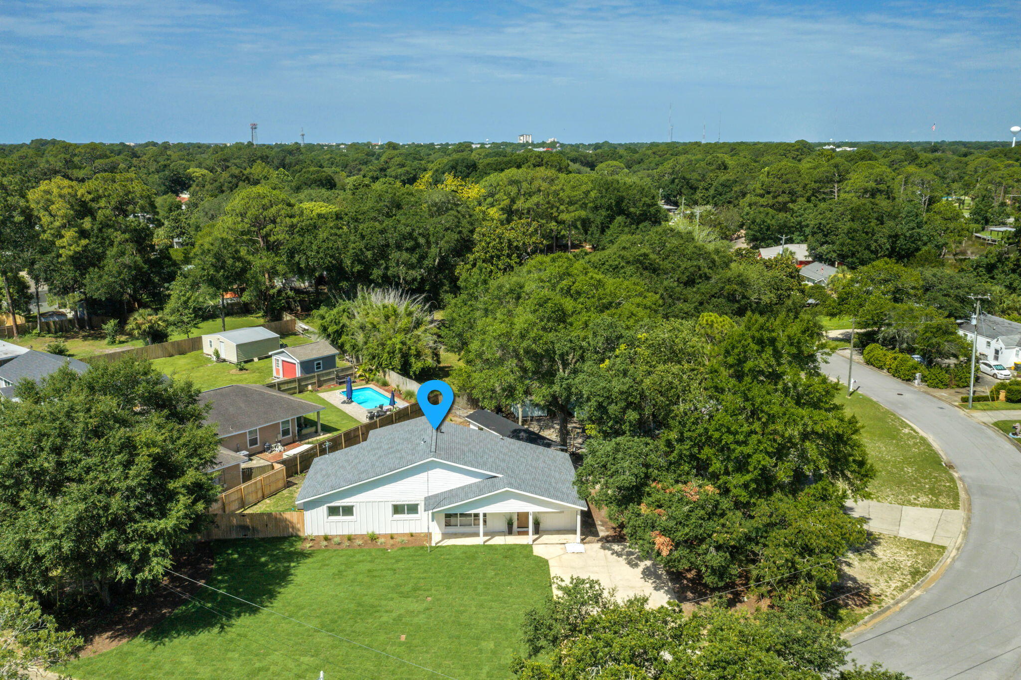 Renovated home in the desirable Elliot Point neighborhood with 1887 sq ft, 4 bedrooms and 2 full baths! This home has a new 30 year dimensional shingle roof, new wiring, plumbing, HVAC, and piping for gas.  Elliot Point is 5 minutes to the beach, a few blocks to Pickleball, Tennis courts, a great school and a short golf cart ride to all that Downtown Fort Walton Beach has to offer. Enjoy cozy and modern coffee shops, Parlor Donuts, listening to live music at Jake and Henry's, and shopping. This block and frame home was built in 1957 and renovated in 2026. This would make a perfect home or short term rental investment! Homes in this area can exceed $70,000 per year in rental income. In addition to being only minutes to the Yacht Club the property is located across the street from Lake Earl which opens into the Choctawhatchee Bay. The home has an open concept design, vaulted ceilings in the primary bedroom, bathroom, and kitchen area, and blends charming and elegant interior finishes. The kitchen is prefect for entertaining with a center island that seats 4, an eat in kitchen area for large dining room sets. The custom Kraftmaid cabinetry boasts glass doors, soft close drawers, crown and light rail. The natural stained wood adds warmth to the space and creates a classic and organic look. The full height, custom tiled backsplash has texture and a white matte finish. The tile and the chimney-style range hood provide a beautiful focal point in the kitchen. The countertops are white quartz and the pulls on the cabinetry are black matte. The French Door, counter depth refrigerator also has a custom surround and creates a seamless, built in appearance. The island features a 950 watt microwave drawer! There is a stainless and black gas stove, a stainless dishwasher, and undermount sink. If you want an electric stove the home has the outlet for this also! The kitchen is finished off with a beautiful glass and black matte chandelier, recessed lighting on dimmers, and flush mount lighting. The kitchen opens to the first living room or what could be another area for formal dining. There are antique, large picturesque windows that showcase the newly landscaped front yard and flower beds. There is a larger family room perfect for oversized sofas and watching movies with surround sound. A new laundry room has been added to feature space for stackable washer and dryer or side by side units. On the front side of the home there are three bedrooms and a full bathroom. These rooms have closets with either bifold or a recessed panel door. All rooms have custom black matte ceiling fans. The guest bathroom features a beautiful white vanity with a quartz top. There is a black matte sink and tub/shower faucets and a newly restored cast iron tub. The tiled surround has special order large tiles in matte white. The mirror and light fixture work together to compliment the space! The primary bedroom and bathroom are show stoppers! There are vaulted ceilings in both the primary bedroom and bathroom. The primary bathroom has a large tiled surround with beautiful white matte tile, a double vanity, a large mirror over the vanity with custom lighting. The primary bedroom has recessed lighting and a black matte ceiling fan that was a custom order. There is a large walk in primary closet with a ceiling height that will provide extra storage area. The home features wide luxury vinyl plank with warm tones to perfectly match the kitchen. There is custom modern wood casing around the doors and windows. The home has been rewired and has all new light fixtures and smoke detectors. The plumbing has been updated to pex, and there is a new HVAC unit. In addition, the home has been piped for a gas, tankless hot water heater, stove, and heating system. Windows were replaced from single pane to double pane years ago. They have been checked for correct operation by Glass Doctor. There are new exterior doors to include two sliding glass doors, a backdoor and a wood stain like front door.  No flood insurance is required and there is no HOA. The front driveway has plenty of room for a boat trailer, RV, or multiple vehicles. The front yard has new sod and beds with mulch. A new well and sprinkler system was put in with a Rainbird timer. The shed was refurbished and provides extra storage for beach equipment and lawn equipment. There is a large, open, natural wood deck. This deck is perfect for grilling and entertaining guests. The fencing on one side of the home is privacy fencing with a large gate. The back yard is completely fenced with a combination of wood and chain link fencing. The exterior of the home is board and batten. There are new motion detection lighting and exterior lighting for the deck and covered front patio. The home has a termite bond. This home is ready to be the next best short turn rental in the area or your home!! Warranties will be provided for the wiring, plumbing, roof and HVAC. Buyer to verify all dimensions and information.