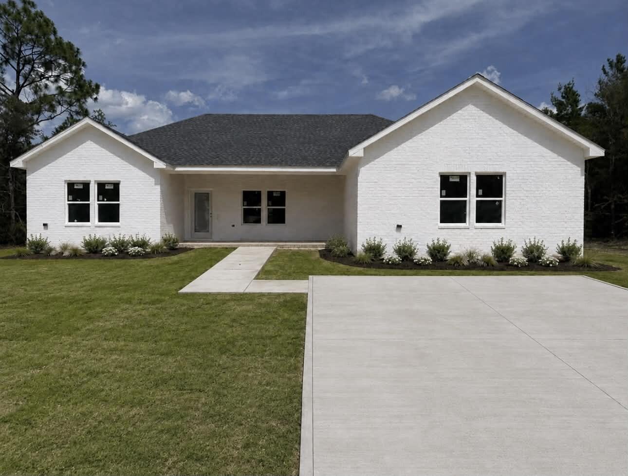 Seller is offering up to $6,000 toward the buyer's allowable closing costs! This brand-new 4-bedroom, 3-bath home offers approximately 1,811 heated square feet with a spacious open-concept layout and split-bedroom floor plan designed for both comfort and functionality. Situated on approximately 0.49 acres, this home features white shaker cabinetry, quartz countertops, island seating, matte-black finishes, Coastal Dune flooring and solid-wood doors. The private primary suite features a walk-in closet, double vanities, soaking tub, and separate shower. Additional highlights include epoxy-coated covered front and rear porches, durable Hardie board siding and white painted brick front exterior.

Conveniently located near shopping, dining, schools, and downtown DeFuniak Springs while still offering a peaceful setting.