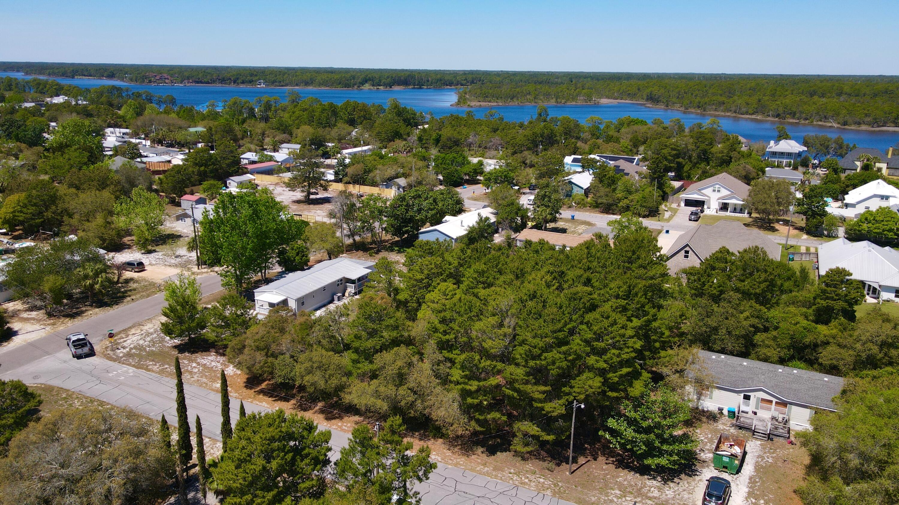 Situated on just under HALF AN ACRE, this property offers space, flexibility, & a location that's getting harder to find in Panama City Beach. Whether you're looking to build, invest, or create your own coastal retreat, the possibilities here are wide open.

Tucked away in a quiet area while still close to everything, you're just a short drive to BEACH ACCESS along the Gulf, where white sand & emerald water set the tone for everyday living. Spend your mornings by the water, afternoons out on the boat, & evenings enjoying the privacy of your oversized lot.

For boating & outdoor enthusiasts, a NEARBY PUBLIC BOAT RAMP provides easy access to Lake Powell & surrounding waterways. Conveniently located near shopping & dining, this property brings together space, location, & potential.