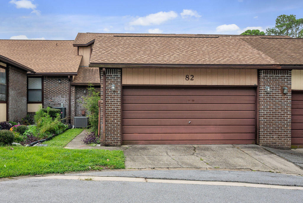 Selling Strictly As-Is! Major updates include a 2021 roof and 2023 HVAC for added peace of mind. Welcome to this peaceful waterfront townhome community, where you can enjoy a relaxed lifestyle with direct access to Toms Bayou. This spacious two-story townhome features a desirable floor plan with the primary suite conveniently located on the first floor, complete with an en-suite bathroom. The main level also offers a well-appointed kitchen, dining area that opens to the expansive living room, a half bath for guests, a two-car garage, and a large, screened porch, perfect for enjoying the tranquil surroundings. Upstairs, you'll find newer carpet, two additional bedrooms, a full bathroom, and a versatile loft overlooking the living room, ideal for a home office, reading nook, or additional living space. Residents enjoy a beautiful waterfront community pool and dock on Toms Bayou, offering endless opportunities for fishing, boating, paddleboarding, kayaking, and more. Conveniently located less than five minutes from Eglin AFB's East Gate, Doc's Oyster Bar, and Lincoln Park, this home also includes a valuable additional assigned parking space located in the cul-de-sac directly across from the unit.  Priced to sell. Don't miss your opportunity to own this spacious townhome in a serene waterfront community!