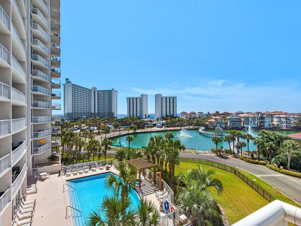 Rarely available 3-bedroom, 3-bath corner residence at The Terrace at Pelican Beach, located in the heart of Destin. Offered fully furnished, Unit 401 features a spacious 1,400-square-foot floor plan, abundant natural light, Gulf and lake views, and nearly 300 square feet of outdoor living space across two private balconies.

The flexible layout comfortably accommodates up to eight guests. The third bedroom includes a private bathroom, mini-kitchen, and its own balcony, providing additional privacy for guests. With three full bedrooms and bathrooms, a corner location, generous living space, and strong short-term rental potential, this property is well suited for use as a vacation rental, second home, or primary residence.

Owners and guests enjoy access to amenities throughout both The Terrace and Pelican Beach Resort. These include private beach access, three adult swimming pools with Gulf-front, lakefront, and indoor/outdoor options, a kiddie pool, two hot tubs, fitness centers in both buildings, tennis and pickleball courts, a video game room, outdoor grills, the Pelican Beach Café, and a seasonal beachfront tiki bar.

The resort's private beach is easily reached by a dedicated walkway through the Pelican Beach grounds. This central Destin location also offers convenient access to restaurants, shopping, boating, golf, entertainment, and many of the area's most popular attractions. Fully furnished and offered at $550,000, this is a rare opportunity to own a spacious 3-bedroom Destin condo with Gulf views, beach access, extensive resort amenities, and excellent vacation rental potential.