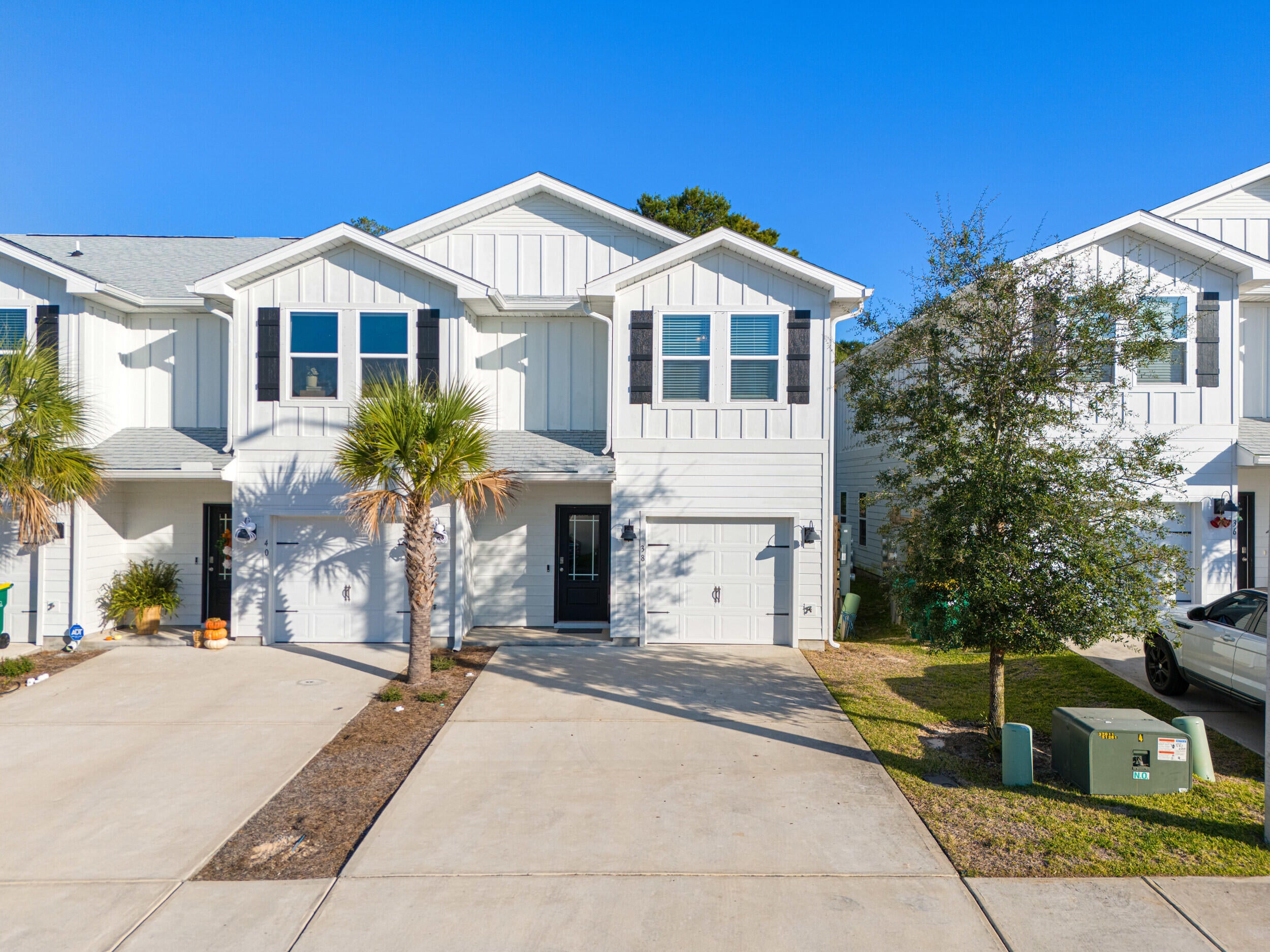 Welcome to Harbor Place Townhomes, where convenience meets coastal living. An expansive two-car driveway and end-unit location welcome you home. Inside, the 3BR/2.5BA layout offers an open main level ideal for entertaining. Step into a bright kitchen with white cabinetry, quartz countertops, a center island with farm-style sink, and stainless steel appliances. All bedrooms are upstairs for added privacy. Enjoy quick access to restaurants, shopping, golf, water parks, Crab Island, white-sand beaches, and an easy commute to Eglin AFB or Hurlburt Field. Whether you're looking to relax, entertain, or explore everything the area has to offer, this townhome combines comfort, style, and an unbeatable location.