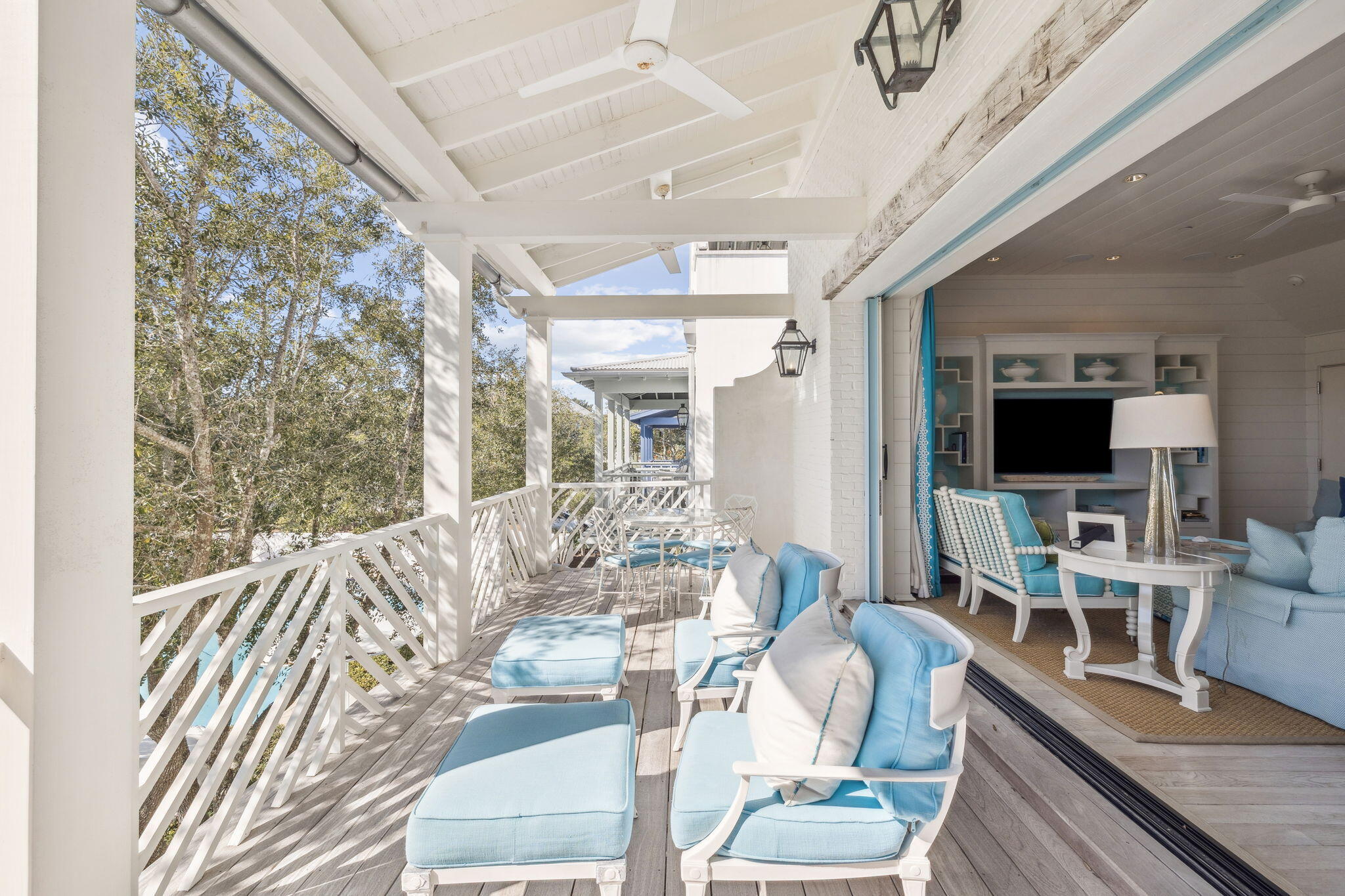 Nestled in the heart of iconic Rosemary Beach, 63 Johnstown Lane is a sophisticated five-bedroom, five-and-a-half-bath coastal residence offering approximately 3,493 square feet of impeccably designed living spaces. Custom built by Benecki Homes and Melanie Turner Interiors, this never-rented home masterfully blends timeless craftsmanship with refined modern coastal design. The main living level features oversized sliding pocket doors that open to sweeping views of the idyllic Cabana Pool and surrounding community greenery. The gourmet kitchen is equipped with Wolf and Sub-Zero appliances, a custom-designed hood, generous storage, and thoughtful finishes that balance elegance and function. Separated from the living area by the stairway hall is the second-floor guest suite. On the first floor, two bedrooms overlook Cabana Pool and courtyard and are adjacent to a laundry room, an office nook, and multiple storage areas that lead to the garage. The third floor features a second living room, six twin bunk beds, and a full bathroom. The home's private outdoor spaces are equally impressive: a beautifully landscaped courtyard showcases mature plantings, a fire pit, and a serene water feature, creating an ideal setting for intimate gatherings or relaxed evenings under the stars. A standalone carriage house above the oversized two-car garage offers additional versatility, featuring a king bedroom, two twin bunks, a full living area, and a full kitchen   deal for guests, extended family, or potential rental income. Positioned just steps from Rosemary Beach's acclaimed amenities, including multiple community pools, a fitness center, tennis courts, boutique shops, restaurants, and the town center of one of Florida's most coveted coastal communities.