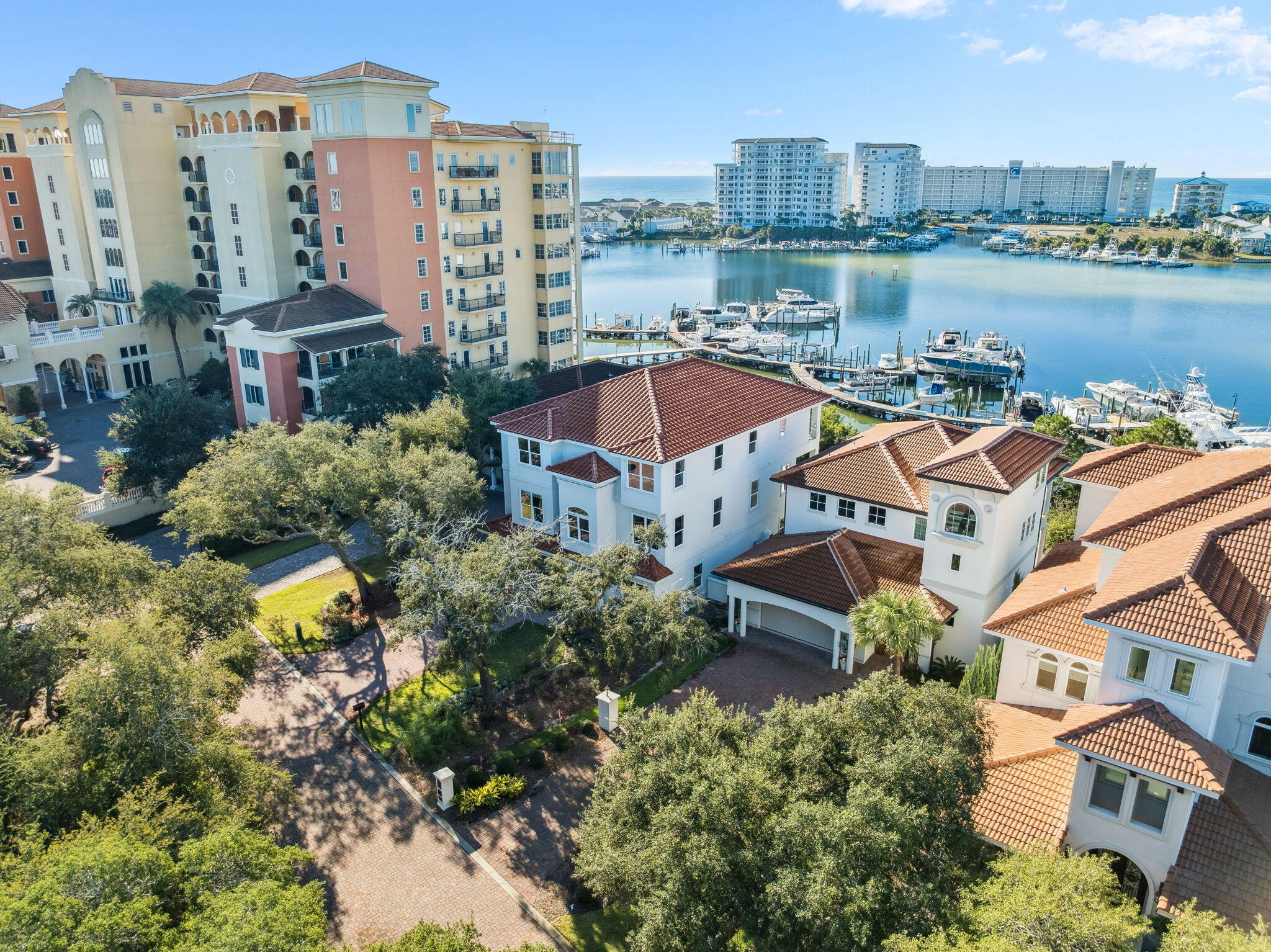 Completed in 2024, this stunning harborfront home offers the ultimate in luxury coastal living with panoramic views of both the Destin Harbor and the Gulf. Thoughtfully designed and newly built, this residence captures the best of modern architecture and waterfront elegance in one of Destin's most desirable locations.

Constructed with 2x6 framing, the home provides enhanced strength, durability, and energy efficiency—reflecting a commitment to quality and long-term performance rarely seen in new coastal builds. Inside, the spacious floor plan features 6 bedrooms and 7 bathrooms, with each bedroom offering its own private en-suite bath for comfort and privacy. Multiple oversized living areas provide abundant space for large families or those who love to entertain. Expansive windows and glass doors fill the home with natural light and showcase breathtaking water views from nearly every room.

At the heart of the home is a true chef's kitchen, designed for both style and functionality. It features double islands, top-of-the-line appliancesincluding Wolf and Sub-Zerocustom cabinetry, and generous counter space for meal prep and gatherings. A second full guest kitchen adds versatility, perfect for hosting, extended family, or private catering.

Outdoor living is equally impressive, offering spacious balconies and covered patios ideal for morning coffee, outdoor dining, or unforgettable sunset views over the harbor. The private pool and hot tub create a resort-style environment, allowing you to relax while taking in the beauty of the surrounding water.

Additional features include a residential elevator, a two-car garage with storage, and high-quality craftsmanship throughout, showcasing modern coastal design and attention to detail at every turn.

For boating enthusiasts, a 36-foot boat slip is available for purchase separately, offering direct access to the harbor and quick passage to the Gulf.

With modern design, premium finishes, 2x6 construction, and unbeatable views of both the harbor and the Gulf, this exceptional property presents a rare opportunity to own a newly built luxury waterfront residence in the heart of Destin. Perfect as a full-time home or secondary retreat, it embodies the very best of coastal living.