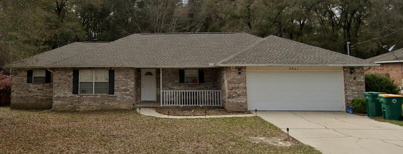 This all brick 3 bed, 2 bath home offers 1,705 sq ft on a quiet cul-de-sac just outside Crestview. Less than five minutes from I-10 and downtown, it blends country peace with city convenience.

Inside, cathedral ceilings and laminate wood floors create a spacious living room. The split floor plan ensures privacy, with a large primary suite featuring a tray ceiling, garden tub, dual vanities, shower, and walk-in closet. Tile floors in the kitchen, dining, baths, and laundry make upkeep easy.

Outside, enjoy a fenced backyard with no rear neighbors, an arbor-covered patio, and a storage building. The two-car garage includes an extra storage closet.
Step inside through the oversized foyer into a massive living room featuring soaring cathedral ceilings and upgraded laminate wood flooring. The kitchen and dining areas showcase elegant tile flooring, which also extends into the bathrooms and laundry room for easy maintenance.

The thoughtfully designed split floor plan provides added privacy, with the secondary bedrooms located on the opposite side of the home from the primary suite. The spacious primary bedroom features a tray ceiling and plenty of room for a sitting area. The en-suite bathroom includes dual vanities, a relaxing garden tub, separate shower, and an oversized walk-in closet.

Enjoy cooking and entertaining in the open kitchen that flows seamlessly into the dining area. Outside, the fenced backyard offers excellent privacy with no rear neighbors, plus an arbor-covere