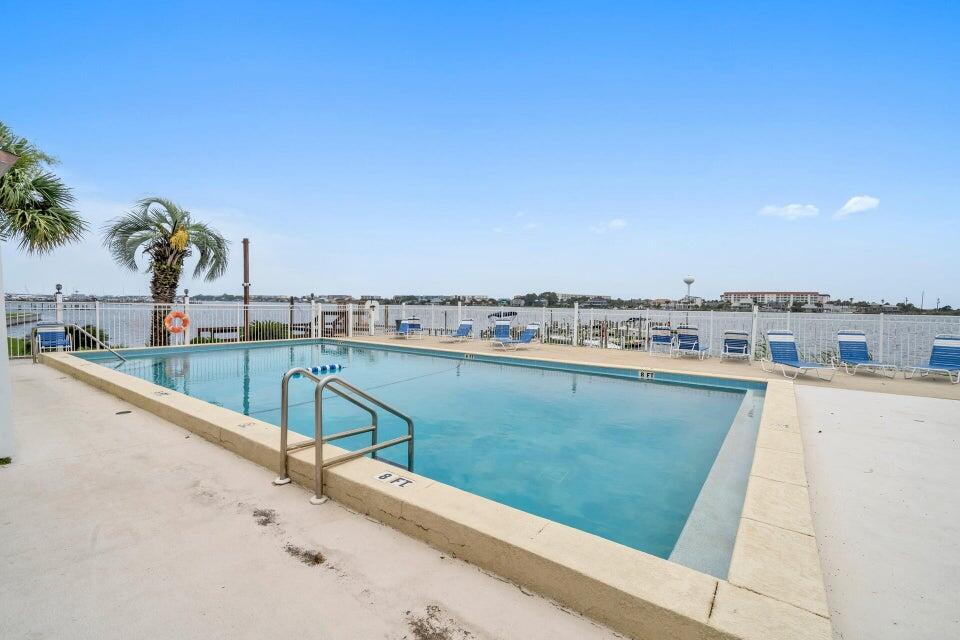 Must See Waterfront Complex with many amenities located on the Santa Rosa Sound. Only 2 miles to the sugar white sands of the Gulf of Mexico.  Welcome Home to your Move in Ready Freshly Painted 1 bedroom unit with updated kitchen & appliances. Remodeled Bath with walk-in shower, & Stylish flooring throughout. Open Floor Plan, Kitchen Bar, & Spacious Bedroom with 3 closets. Enjoy the serene views off your balcony. Fountainhead has so many amenities! Community Club House available for your parties and gatherings with kitchen, billiards, ping pong, television and pool access. Community offers lighted tennis courts & On-Site Laundry, sandy beach, boat dock and fishing. Boat slips, trailer parking& kayak storage available (for a fee)