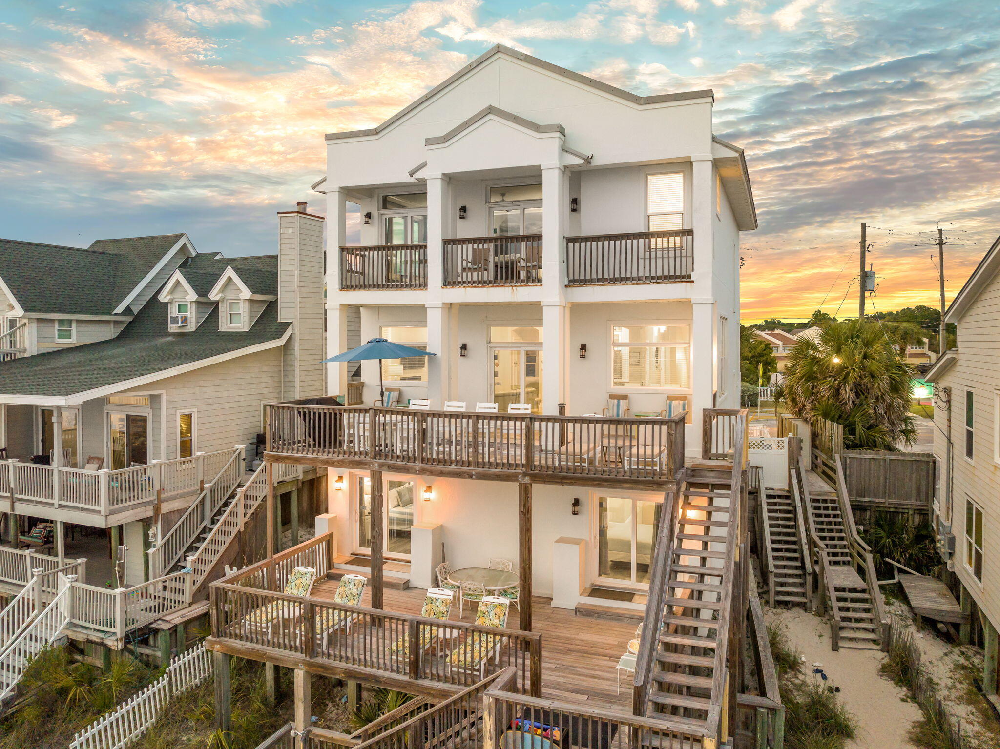 1641 Scenic Gulf Drive is a clean Gulf front position set directly on the sand with unobstructed exposure to the water and no interruption to the sight lines. It is a straightforward execution of what matters in this segment. Immediate beach access, strong vertical separation of living, and a floor plan that consistently pulls the Gulf into focus. The entry level is built for function. Two Gulf front bedrooms sit directly on the sand line, each with access to the rear decks and private walkover. A Jack and Jill bath keeps the layout efficient and durable for both personal use and rental rotation. It does exactly what it needs to do. Close to the water, easy in and out, no wasted space.

Upstairs is where the home opens up. The main living level is fully oriented to the Gulf, with floor to ceiling glass carrying views across the entire living, dining, and kitchen footprint. The kitchen is practical and well scaled with stainless appliances, granite surfaces, and custom cabinetry, positioned to stay engaged with the living space rather than separated from it. A gas fireplace anchors the room without competing with the view. A guest suite with a private bath is set off the main area, convenient but not intrusive.

Outdoor living is handled simply and correctly. Wide decks and covered porches extend the main level, creating usable space that stays connected to the interior. A direct staircase runs from the second floor to the beach, paired with an outdoor shower. Functional, expected, and executed without complication.

The top floor is reserved for the primary, which is where the elevation pays off. The suite is positioned to capture the full Gulf exposure, with a recently updated bath that follows the same orientation. Dual vanities, walk in shower, and soaking tub all aligned with the view. An additional ensuite bedroom on this level adds flexibility without taking away from the primary's presence.

The supporting pieces are in place. Ample parking, a two car garage, and real storage for beach equipment. Details that matter day to day and translate directly to rental performance.

Set along Scenic Gulf Drive with quick access to the restaurants, retail, and resort infrastructure of Miramar Beach, this is a no miss Gulf front offering. It is positioned correctly, laid out correctly, and built around the one thing buyers are here for, the water.