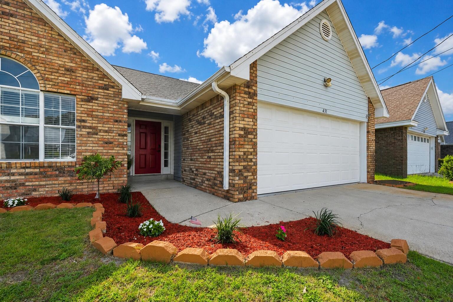 Modern industrial-inspired finishes meet energy-saving luxury just minutes from Hurlburt Field! Vaulted ceilings and updated metallic fixtures give the home a clean, modern feel.

Situated on approximately .12 acres, the exterior features a 2-car garage, extended driveway, irrigation system, fully fenced backyard, and garage utility sink for added convenience.

Step through the foyer onto rich high-gloss wood-style flooring with no carpet throughout. The vaulted living area centers around a fireplace, while dimmer lighting in the kitchen and living area creates the perfect atmosphere for relaxing evenings or movie nights.

The updated kitchen features sleek black quartz countertops with reflective detailing, coordinating backsplash accents, custom beadboard cabinetry, oversized double-door pantry with built-in lighting, wine fridge, custom built wine rack, and a designer-inspired dining nook with integrated storage and matching quartz finishes.

The split-bedroom layout offers added privacy, with the spacious primary suite featuring a large walk-in closet and ensuite bathroom complete with a garden tub and separate stand-up shower.

Smart-home features include a Nest thermostat, solar panels, Nest security system, smart keyless front door lock, doorbell camera & exterior camera on the side of the home. Major improvements include paid-off solar panels, new roof prior to closing, 2025 water heater, and 2017 HVAC.