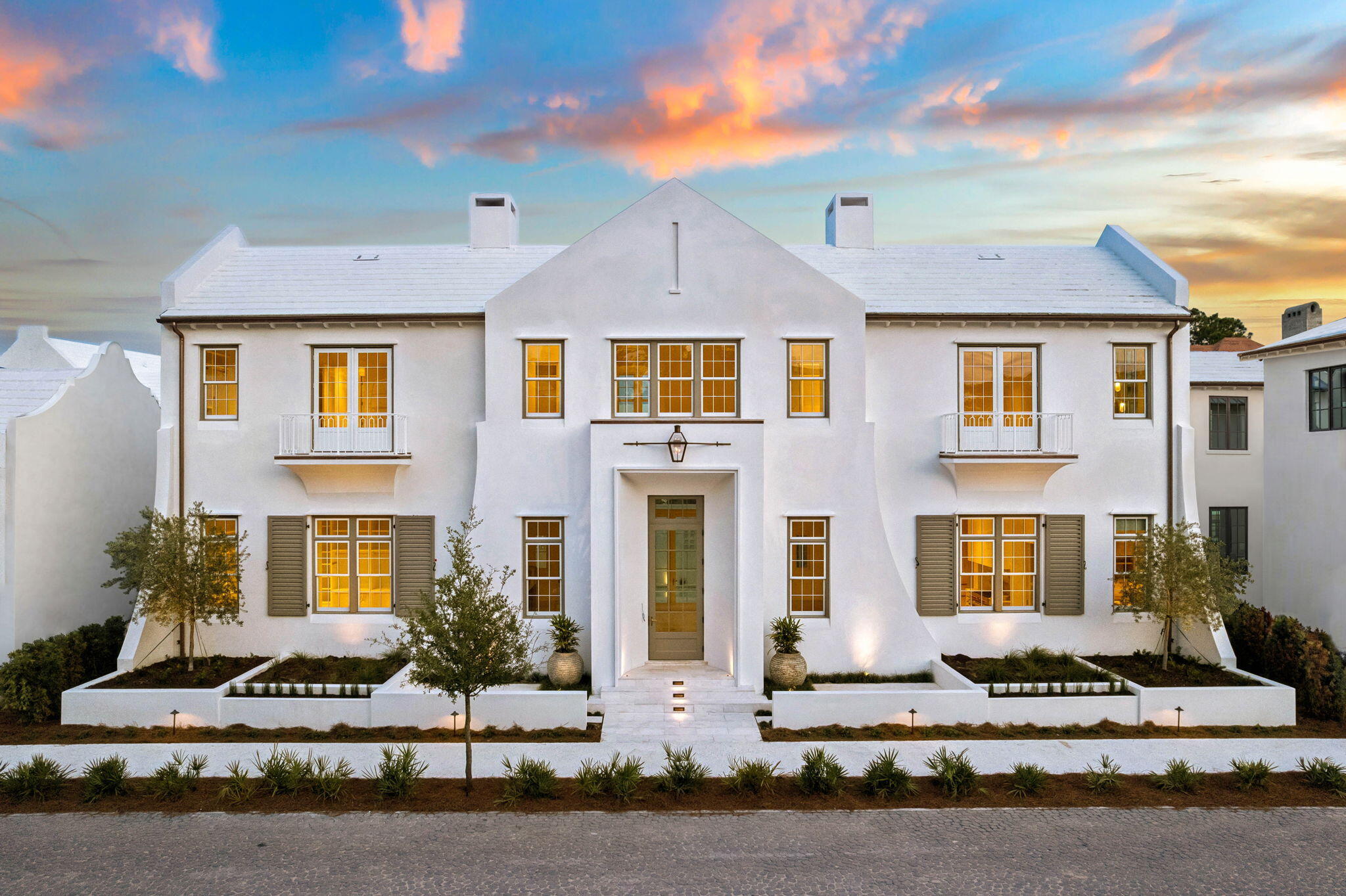 Timeless European architecture and effortless modern living converge in this rare freestanding 5BR/5BA/1HB custom residence spanning 4,833 square feet. An exceptional offering in Alys Beach, the home combines privacy, extraordinary craftsmanship, and a level of finish increasingly difficult to find. From the moment you enter, the residence unfolds around a private courtyard with a pool and spa, covered lounge, and a fully equipped Lynx outdoor kitchen, creating an effortless setting for entertaining, or simply being home.
Inside, Diana Royal stone flooring, Venetian plaster walls, European white oak millwork, Waterworks fixtures, Visual Comfort lighting, and Ashley Norton brass hardware establish an atmosphere of understated luxury throughout. The main salon makes a striking impression with a sculptural Brazilian stone fireplace beneath a soaring 14-foot scalloped plaster ceiling, while the chef's kitchen unites beauty with performance - Italian Matarazzo stone, Wolf and Sub-Zero appliances, integrated wine preservation, a custom bar, and dedicated scullery. The highly desirable main-level primary suite opens directly to the courtyard, offering a spa-inspired bath finished entirely in Paonazzo marble - heated floors, steam shower, soaking tub, custom dressing room, and optional laundry among its quiet indulgences. Upstairs, wide-plank oak floors with herringbone insets lead to the spacious ensuite bedrooms, a spacious media lounge, private office, AV room, and third laundry.. room thoughtfully arranged to provide privacy for family and guests. A conditioned two-car garage with future lift capability completes the residence. Ideally positioned with a direct line of sight to the new Silva Pool and a short stroll to all of Alys Beach's exceptional amenities, this is a distinctive legacy property defined by timeless architecture, exceptional materials, and uncompromising craftsmanship.