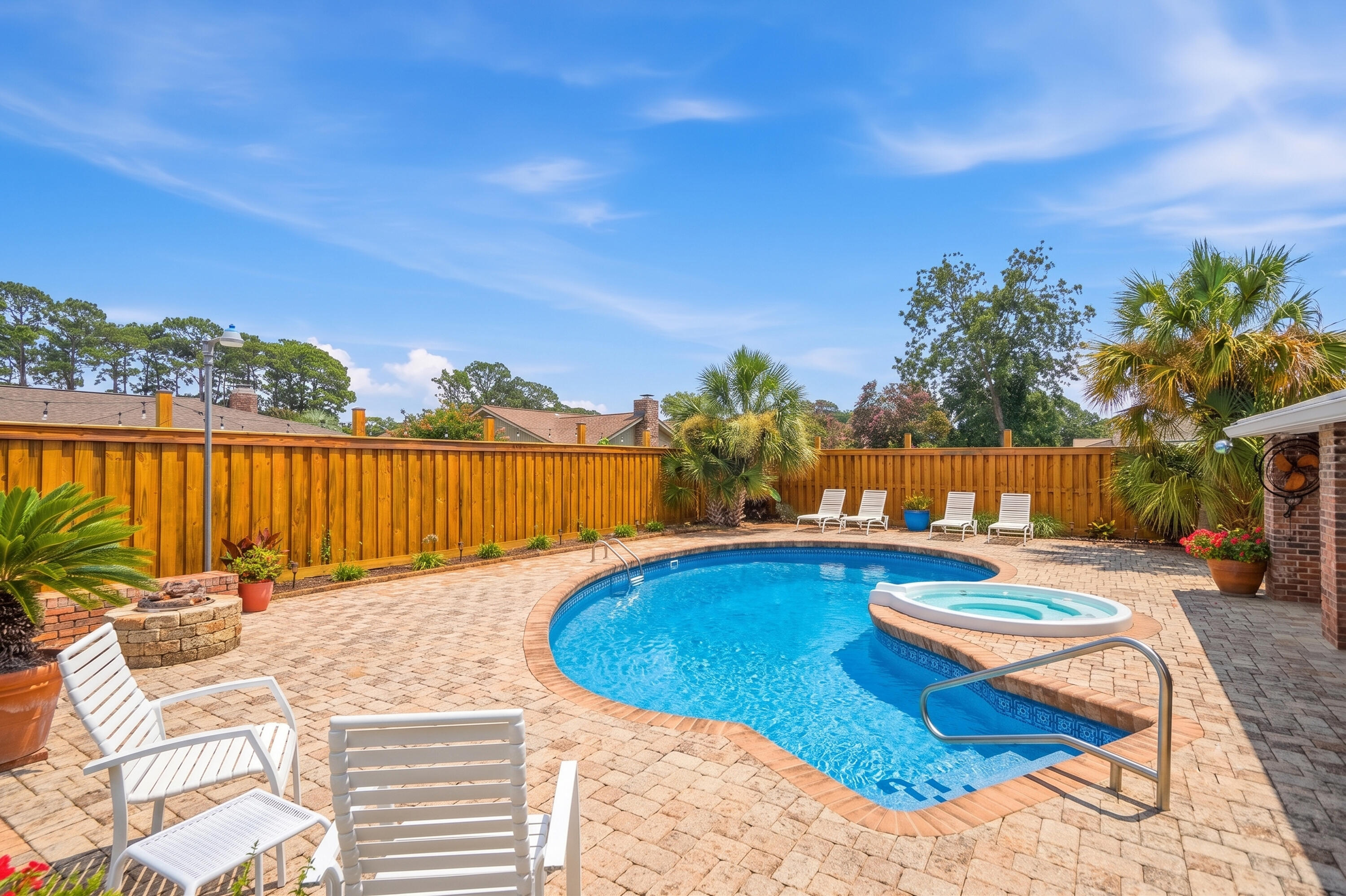 Welcome to this beautifully updated pool home in the highly sought-after Lake Lorraine, conveniently located just minutes from Eglin AFB, shopping, dining, and waterfront recreation. Inside, you'll find multiple living spaces, including a spacious living room with a brick fireplace and a separate family room ideal for entertaining. The kitchen features granite countertops, a gas range with pot filler, dual breakfast bars, recessed lighting, and a large walk-in pantry. The primary suite offers patio access, a walk-in closet, and an updated bath with dual vanities and a glass-tiled shower with dual shower heads. Step outside to your private backyard oasis complete with a heated pool, hot tub, fire pit, and covered paver patio. Major updates include a 2024 roof with upgraded underlayment, impact-rated Shoreline windows, Shwinco entry doors, updated pool equipment, Ring security system, whole-home Ethernet wiring, French drains, shed, 6' privacy fencing, raised garden beds, and a repaved driveway and walkway. This exceptional home combines modern upgrades, resort-style amenities, and an unbeatable location in one of Shalimar's most desirable neighborhoods.
