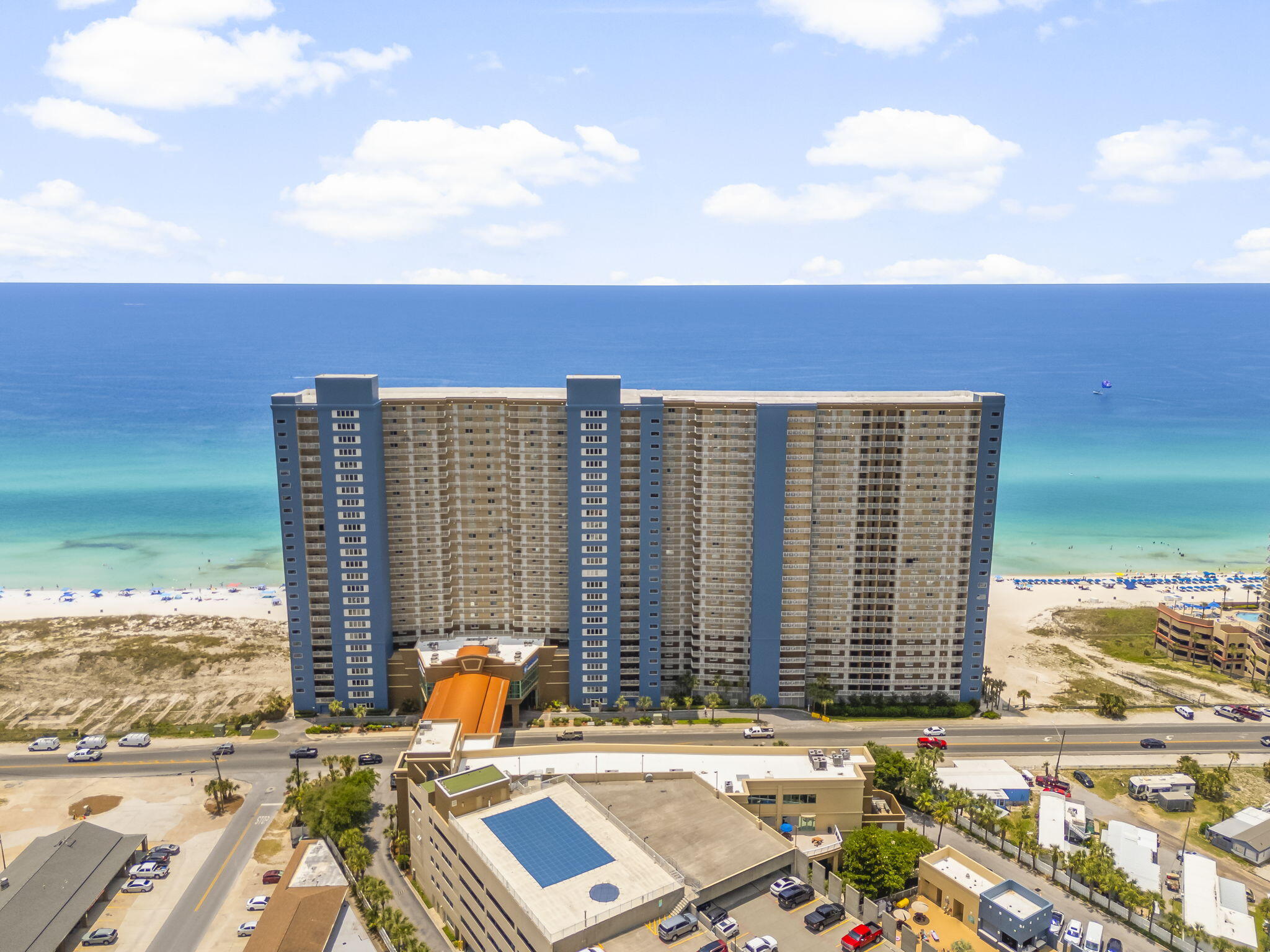 MAJOR PRICE IMPROVEMENT -- NOW OFFERED AT $500,000! Emerald Beach Resort Unit 1925 is a Gulf-front 2BR/2BA condo offering exceptional value for investors, second-home buyers, or anyone ready to own directly on the beach. With beautiful Gulf views, a refreshed coastal interior, and a guest-friendly layout, this unit is well-positioned for strong short-term rental appeal. The open living area flows to a private Gulf-front balcony, while the in-unit arcade game adds a fun feature guests love. Emerald Beach offers Gulf-front pools, hot tubs, a fitness center, direct beach access, and a prime location near Pier Park, Runaway Island, shopping, dining, and entertainment. At this newly reduced price, this is a compelling opportunity to secure lifestyle, location, and income potential in one of Panama City Beach's most popular resorts.