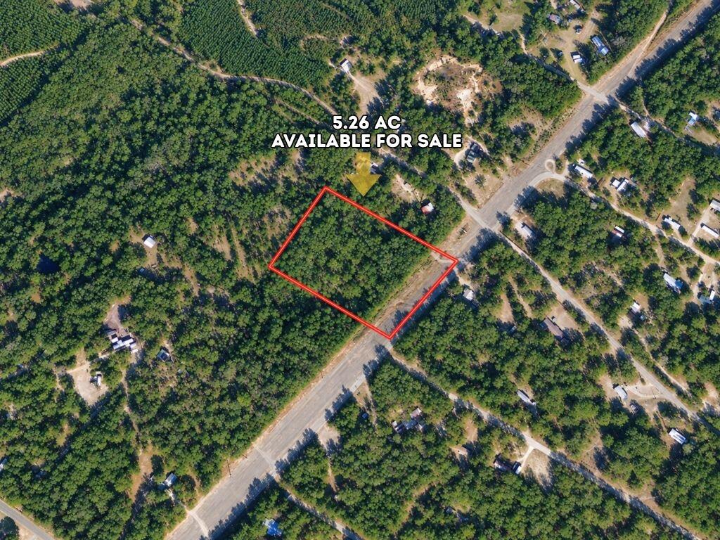 5.26 acres of unzoned land in Walton County, Florida. 35 minutes from Crestview, within an hour of Destin and the Emerald Coast, and with annual taxes of $286. Electricity is available, and the land is clean. no flood zone and no HOA. Barndominiums, single-family, multifamily, modular, manufactured homes, and RVs are all welcome, this is unzoned Florida Panhandle land at its most flexible. Place a barndominium, build a retreat, or hold unzoned acreage within an hour of the Gulf Coast. The land rolls gently, the zoning is unrestricted, and the Gulf Coast is within reach.