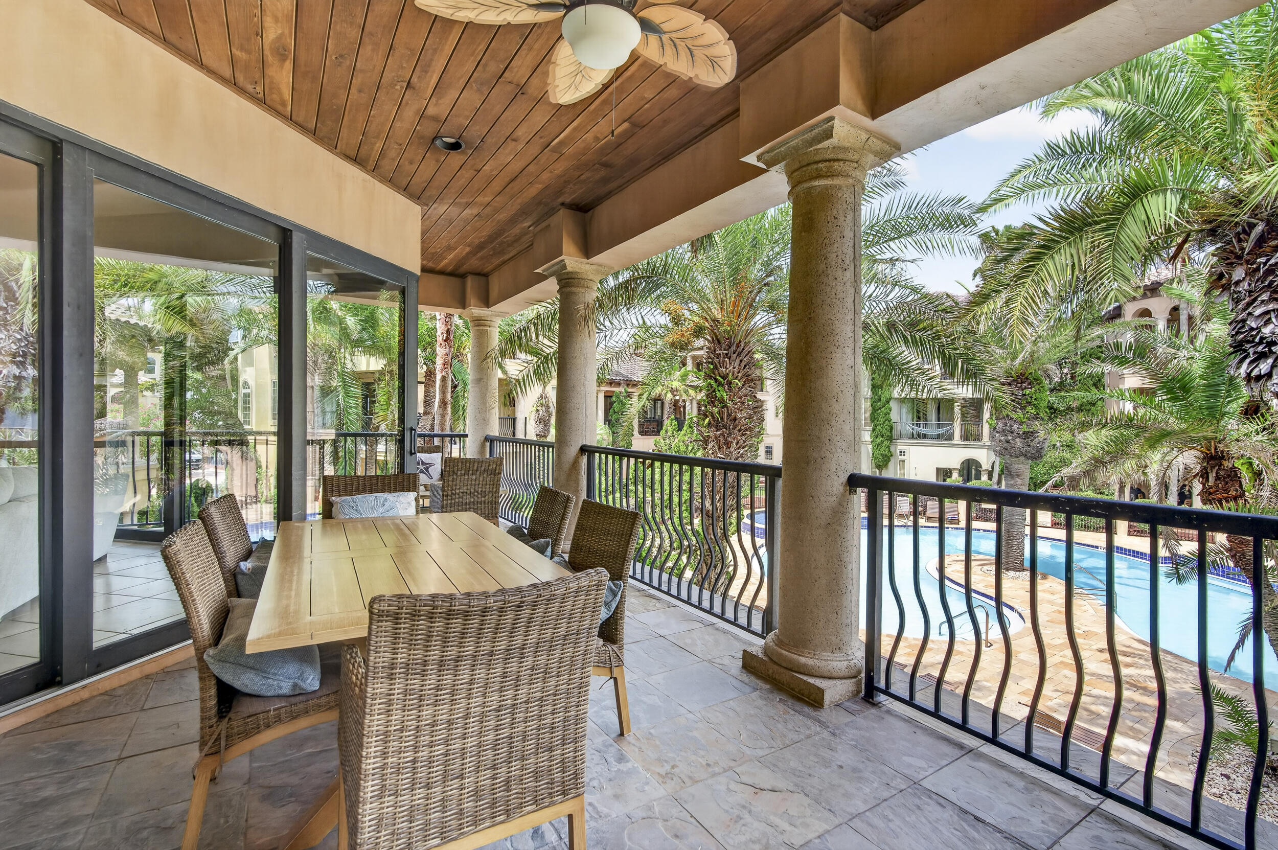 The Oasis at St. Tropez is a stunning two-story Mediterranean-Tuscan inspired beach retreat that seamlessly blends elegance, comfort, and resort-style living. Featuring both a private balcony and patio overlooking the community's lush tropical oasis, this exceptional residence offers a true coastal escape. From the moment you enter this charming resort, you feel transported to a European coastal destination, yet you are just steps from their deeded beach access. Designed with both relaxation and entertaining in mind, the first-floor features two spacious bedrooms, two full bathrooms--including a private primary suite--and a bonus bunk room, providing plenty of space for family and guests. Upstairs, you'll find an additional primary suite along with the open-concept living, dining, and kitchen areas, creating the perfect gathering space after a day at the beach.
The expansive second-floor balcony provides the perfect setting to relax, enjoy the coastal breeze, and grill your favorite meals. Downstairs, the private patio offers direct access to the resort-style pool, creating an ideal indoor-outdoor living experience.
Offered fully furnished, this property is move-in or rental ready. Whether you're searching for a primary residence, second home, vacation getaway, or investment property, The Oasis offers the perfect blend of luxury, comfort, and coastal living. Close to restaurant and entertainment by foot, golf cart or car - your choice.