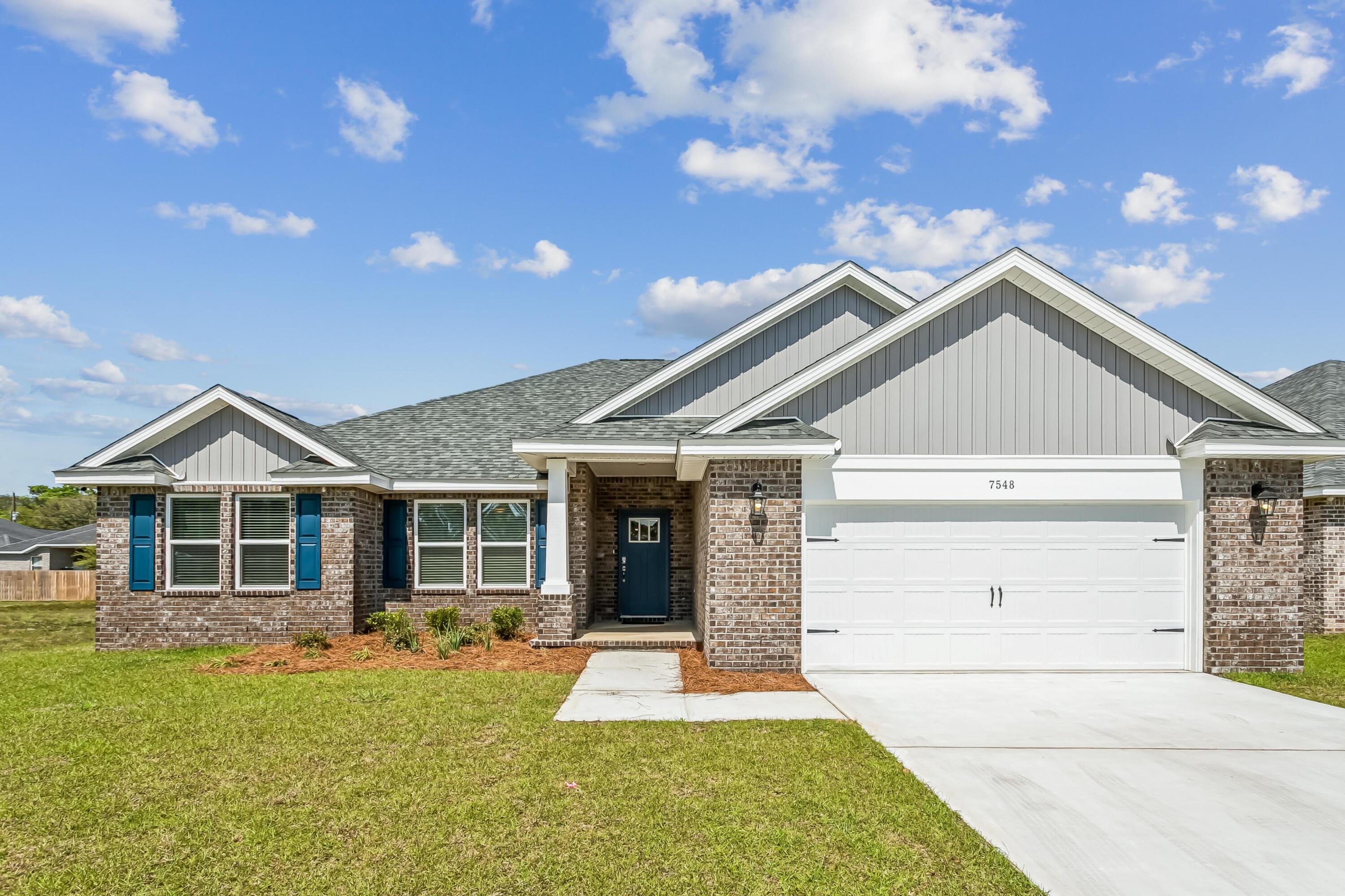 New construction in Buckeyes Landing! The Liberty is a spacious 4-bedroom, 2-bath home featuring an open layout and modern finishes throughout. The kitchen offers stainless steel appliances, granite or quartz countertops, slow-close cabinetry, an island, and a large pantry. The split floor plan provides added privacy, with the primary suite including tray ceilings, double vanities, a tiled walk-in shower, and a garden tub. The fourth bedroom offers flexibility as an office or playroom. Crown molding accents the main living areas, and blinds are included. Buckeyes Landing is ideally situated in the heart of Navarre. The neighborhood is located off Bob Tolbert Road, providing convenient access to major routes including US-98 and State Road 87 for easy commuting east toward Destin or west toward Pensacola. Just minutes from local amenities - including shopping, restaurants, parks, highly rated schools, and world class beaches. Projected completion is November 2026.