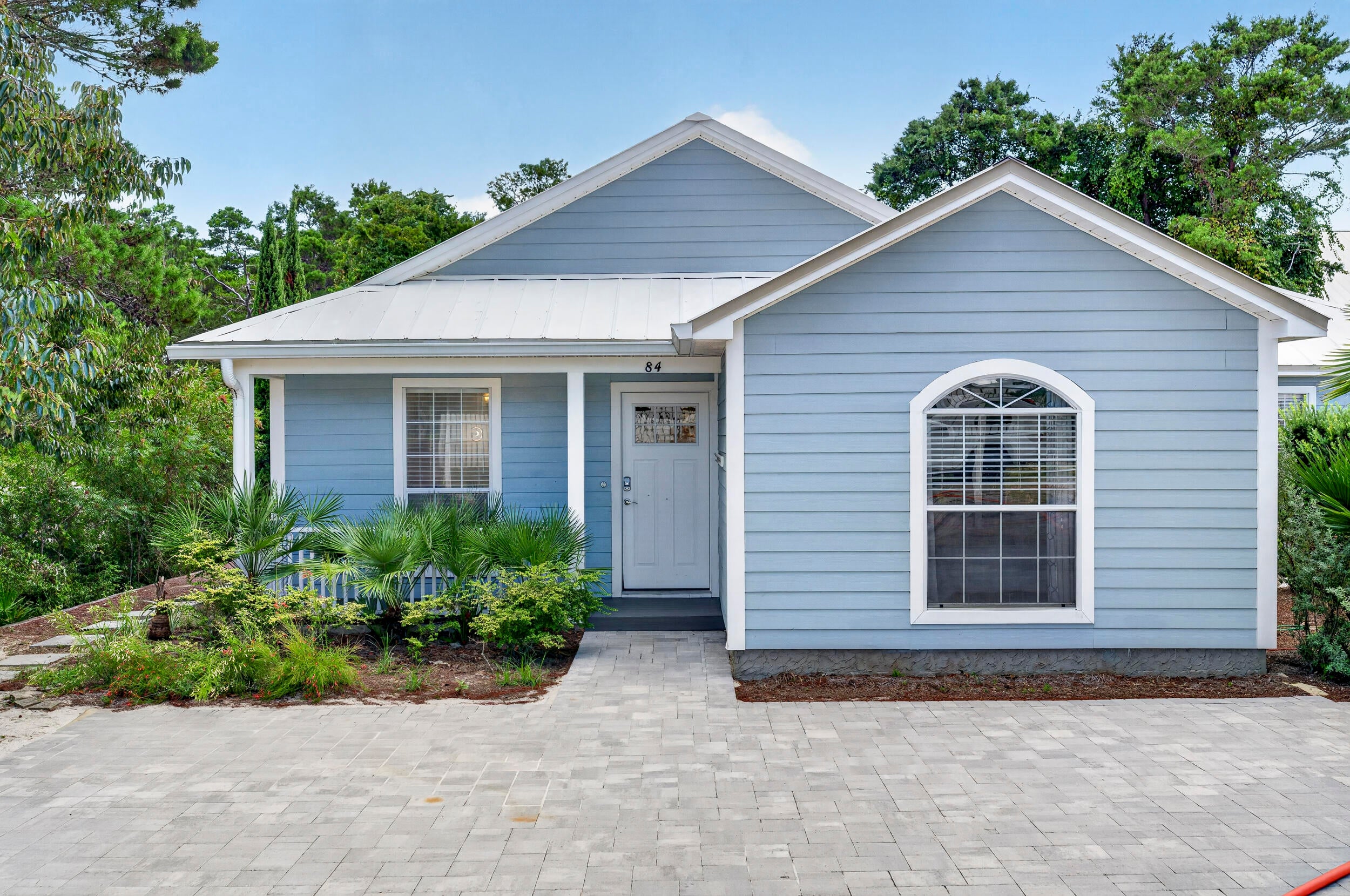 NO HOA and located south of Scenic Highway 30A, just a short walk, bike ride, or golf-cart trip from the beach! This unique Florida beach cottage offers two separate residences under one roof with plenty of space for family and guests. Recent improvements include new flooring, fresh interior paint, and an upgraded outdoor living area.

The main residence features three bedrooms, two baths, a spacious family room, and a full kitchen. The secondary residence offers two bedrooms, one bath, and an open-concept living, dining, and kitchen area. Each side has its own washer and dryer for added convenience and privacy.

The expansive paver patio is designed for outdoor enjoyment with a spa, putting green, and grilling area. Live in one residence and rent the other, or enjoy the entire property as a primary residence, second home, or investment property. With public beach access, restaurants, shopping, and the Timpoochee Trail nearby, this is 30A beach living at its best!