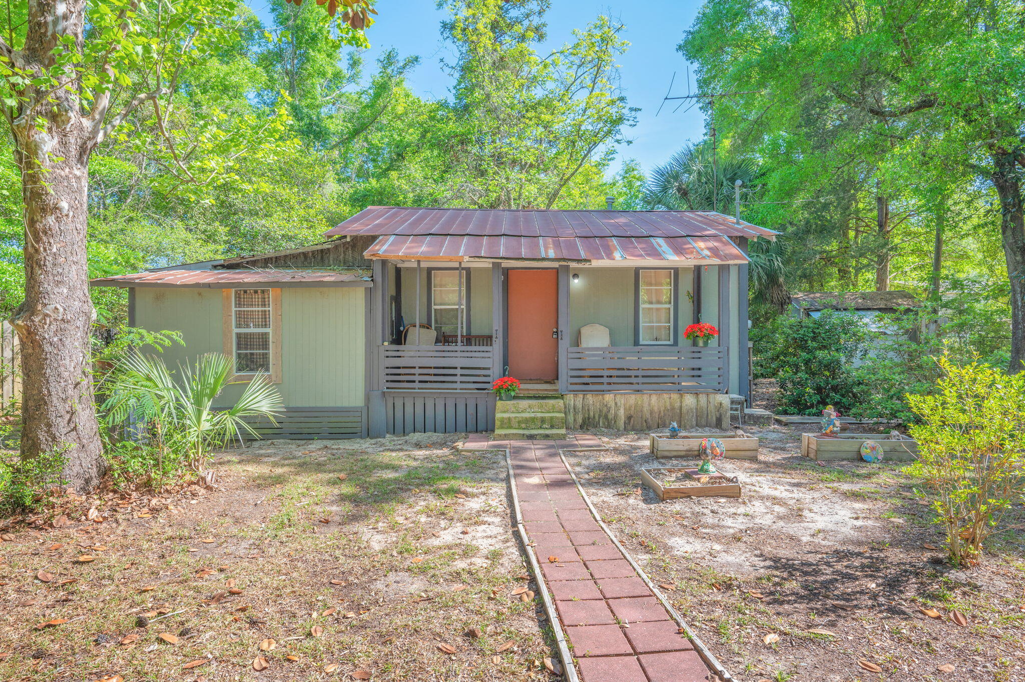 Tucked away on approximately ±0.8 acres, this charming 2 bedroom, 1 bath cabin offers a great opportunity for investors, weekend retreat seekers, or buyers ready to bring their vision to life. With 897 sq ft, this fixer upper is full of potential and comes fully furnished, making it easy to get started on renovations or enjoy it as a rustic getaway. The property features a chain link fenced area surrounding the home, perfect for pets or added privacy. A 19' x 11' workshop provides space for tools, hobbies, or additional storage. Conveniently located on a paved road with public water and septic already in place, the groundwork is there for your improvements.
In it's current state, it will not qualify for financing & is a CASH ONLY sale.