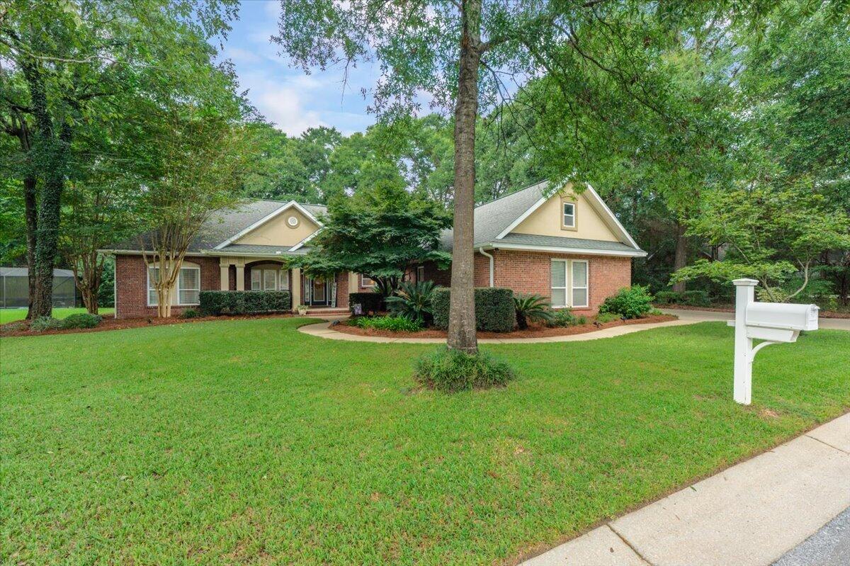 Some homes simply offer more--and this one delivers with a rare combination of space, privacy, thoughtful design and beautifully established surroundings. With a neighboring home on only one side, a true 3-car garage, dedicated office, no carpet and a large covered back porch, there's a lot here to appreciate before you even get to the details! Located on a double cul-de-sac for lower traffic. Inside, 10' ceilings and a flowing floor plan create an open, comfortable feel that's equally suited for everyday living and entertaining. Engineered wood flooring runs throughout the living areas and bedrooms, with tile in the kitchen and wet areas. The kitchen features maple cabinetry with full-extension dovetail drawers, center island, raised breakfast bar, built-in desk, lazy Susan and walk-in pantry. The spacious primary suite offers two walk-in closets, dual comfort-height vanities, a 5' jetted tub and separate shower. Outside, mature shade trees are a haven for many beautiful birds and an impressive collection of established landscaping create a beautiful setting, while HOA common area provides additional separation and open feel. Thoughtful extras include 7.5' tall garage doors, decked attic storage, whole-home gutters, Wi-Fi irrigation, natural gas, surround-sound wiring and additional insulation. HVAC replaced in 2018; septic pumped in 2025. Come see what makes this one stand apart!